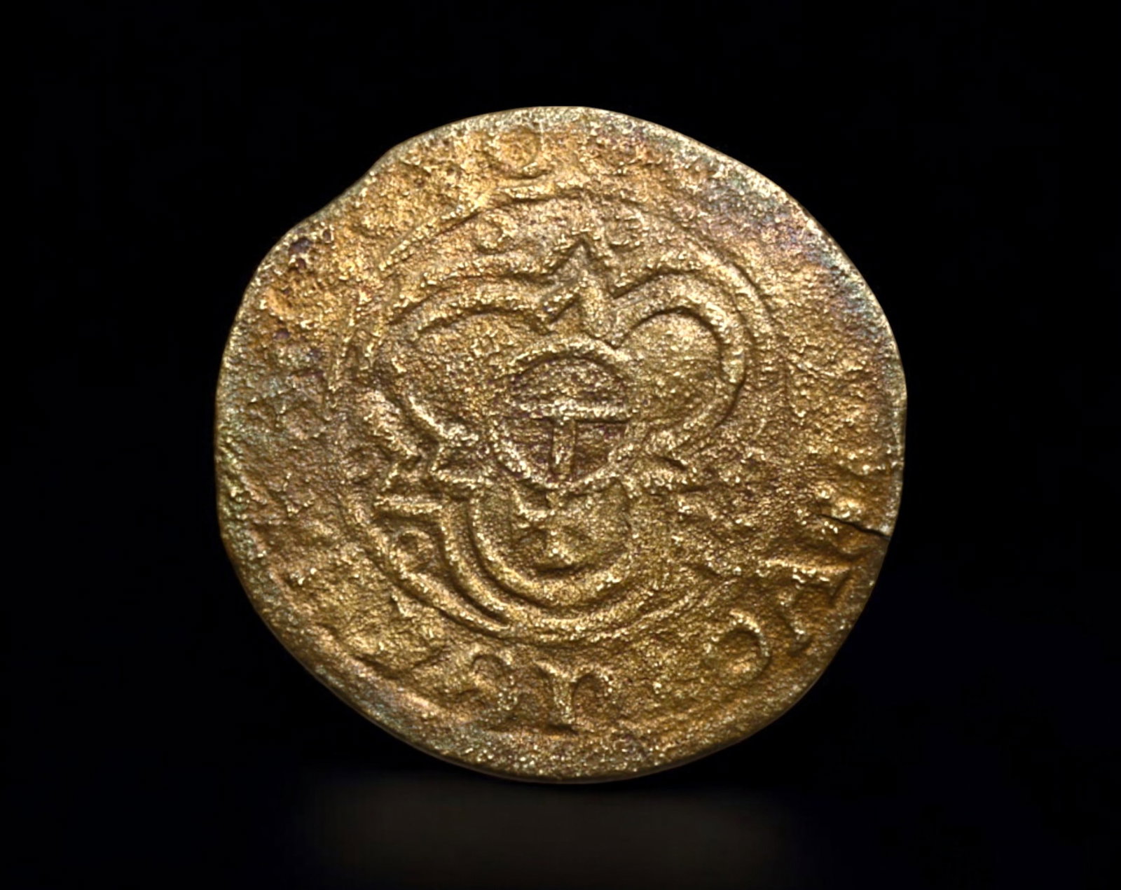 ISLAMIC DYNASTY: Bronze Fals, Circa 12th-14th Century: A historical bronze fals, likely from the Islamic medieval period (circa 12th-14th century), measuring 25mm in diameter and weighing 1.5g. The obverse features a central calligraphic inscription withi
