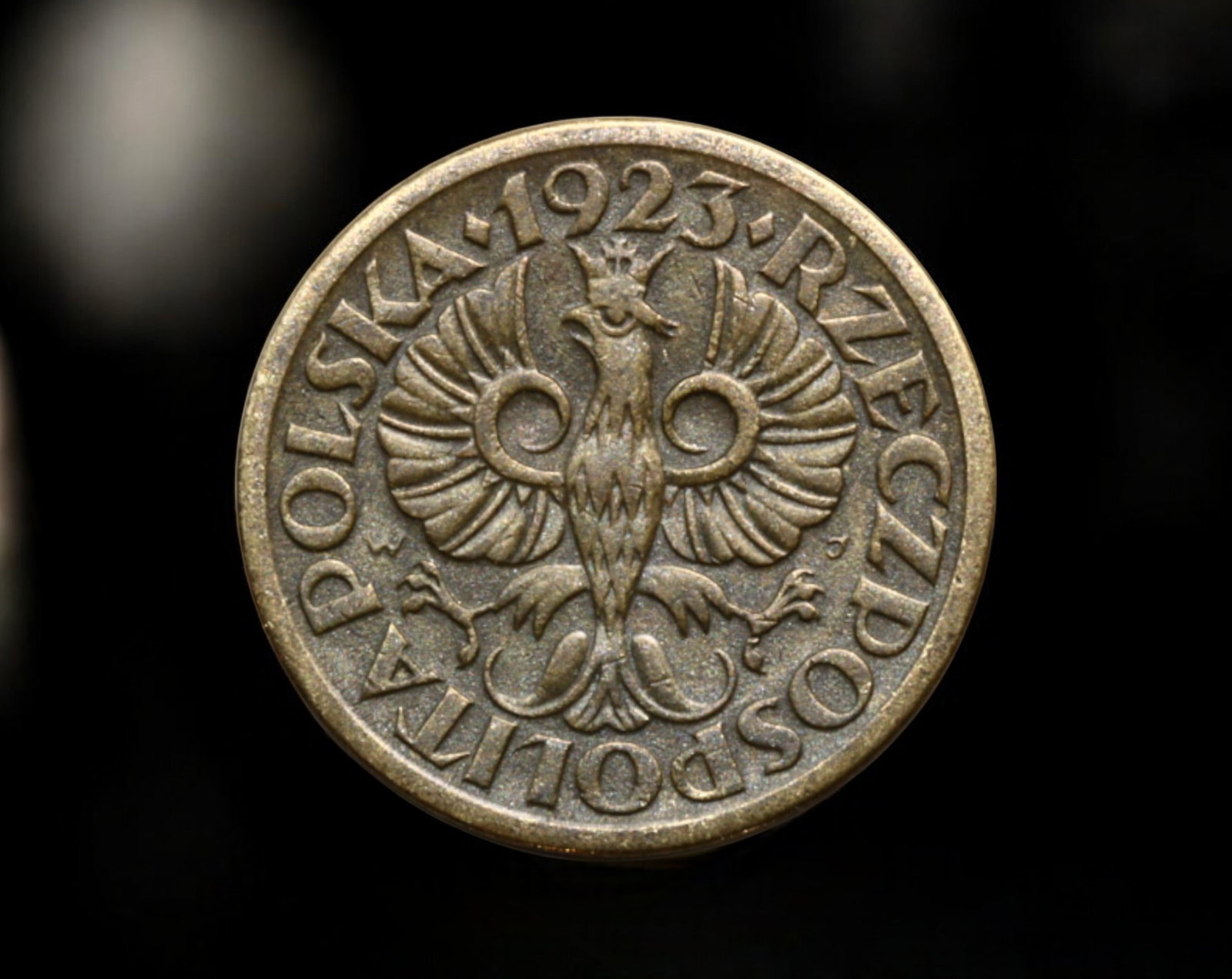 POLAND: Second Polish Republic - 5 Groszy Coin, 1923: A 5 Groszy coin from the Second Polish Republic, minted in 1923. Struck in bronze, this coin weighs 3.4g and measures 2.0cm in diameter. The obverse features the crowned Polish eagle with outstretched