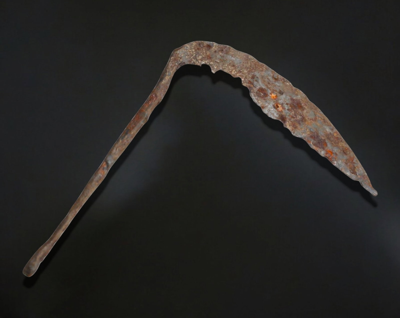 ANCIENT EUROPE: Iron Sickle Blade - Agricultural or Ritual Tool, c. 1st Millennium BCE: A remarkably preserved ancient iron sickle, measuring 18 cm in length and weighing 71g, showcasing the distinct curved blade typical of early agricultural implements. The elongated handle section tape
