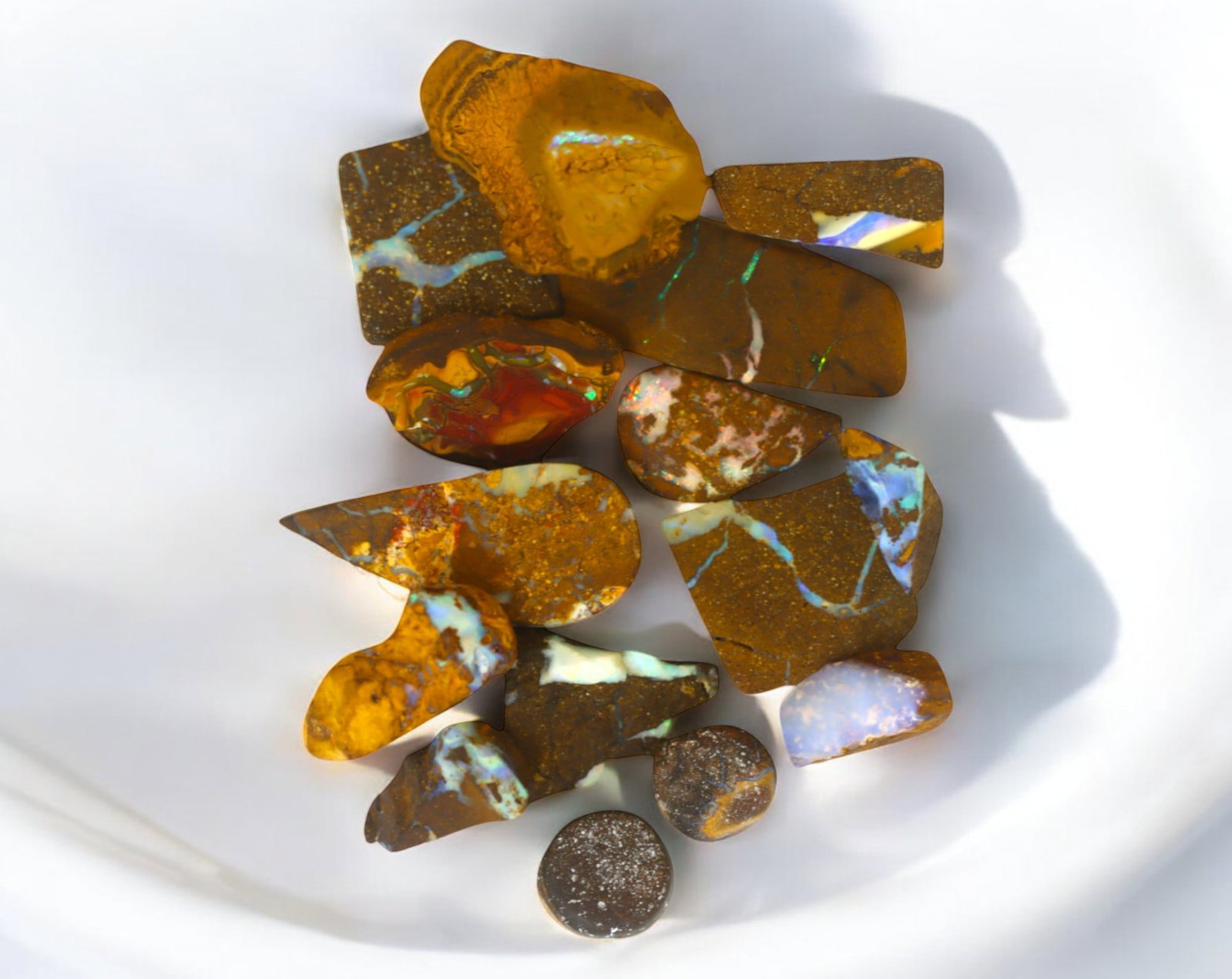 AUSTRALIA: Matrix Boulder Opal Rough Lot, 33g, 1-2.7 cm (Images Taken Wet): Stunning lot of natural Australian matrix boulder opal rough, these specimens showcase a vibrant interplay of opalized veins and swirls embedded in rich ironstone, displaying flashes of electric blues