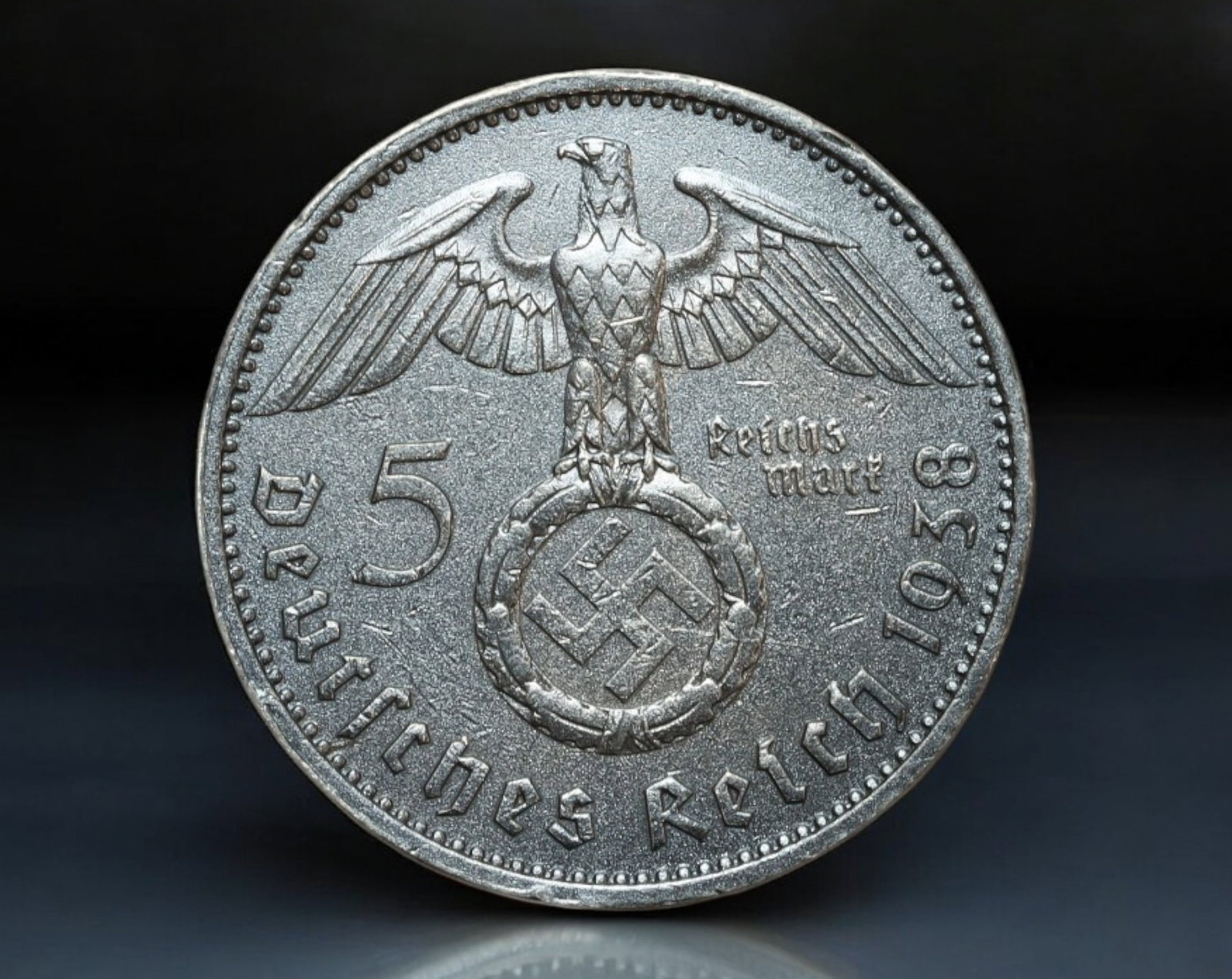 GERMANY/THIRD REICH: Paul von Hindenburg - Silver 5 Reichsmark Coin, 1938 A Berlin: Issued during a pivotal moment in German history, this 5 Reichsmark coin from 1938 features the portrait of Paul von Hindenburg, Germany's revered field marshal and former president. The obverse prese
