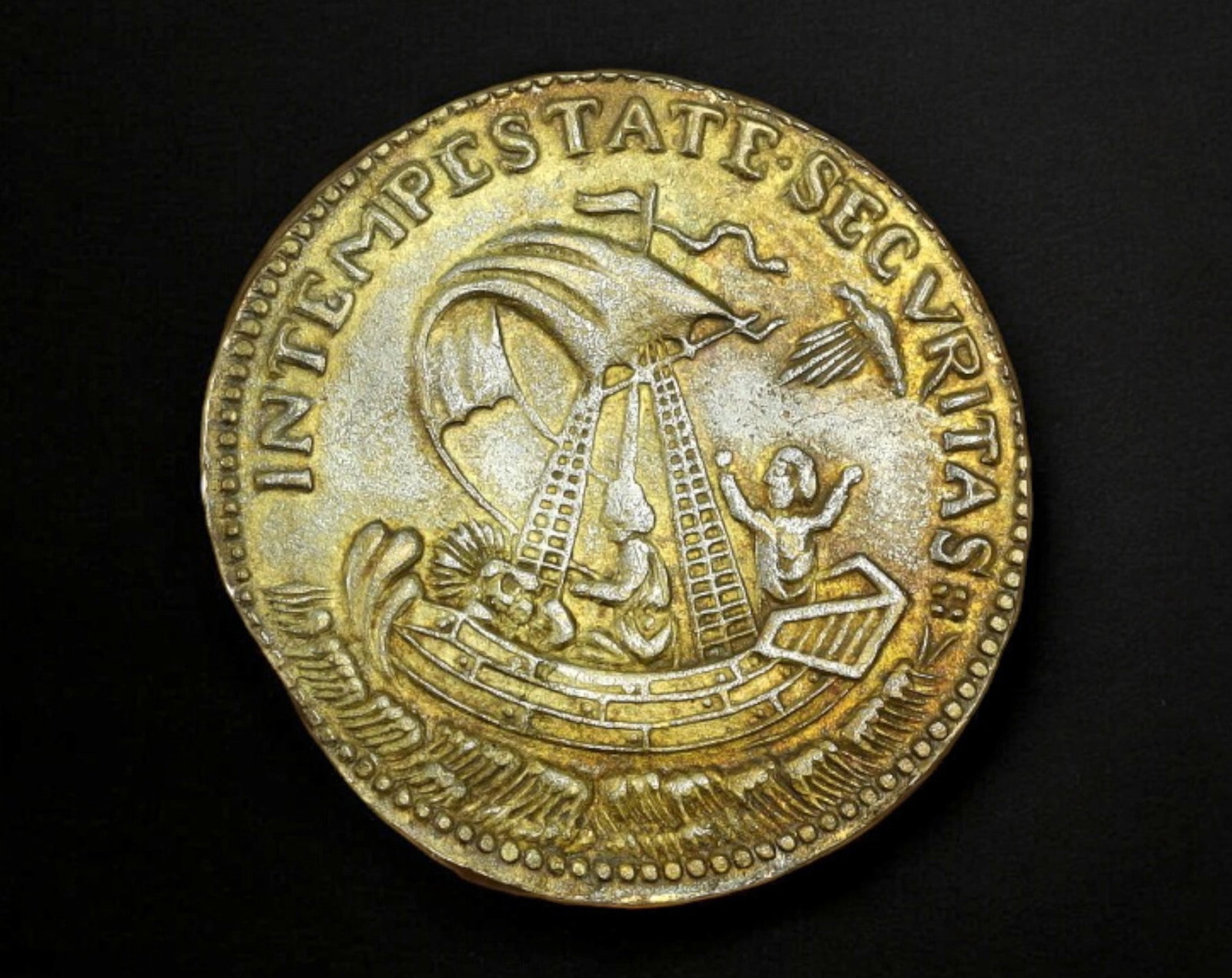 ITALY: St. George & Ship of Faith Token - Brass Religious Jeton, c.18th-19th Century: Struck in brass and measuring 1.9 cm in diameter with a weight of 1.8g, this religious jeton features two deeply symbolic Christian motifs. The obverse depicts St. George on horseback slaying a dragon