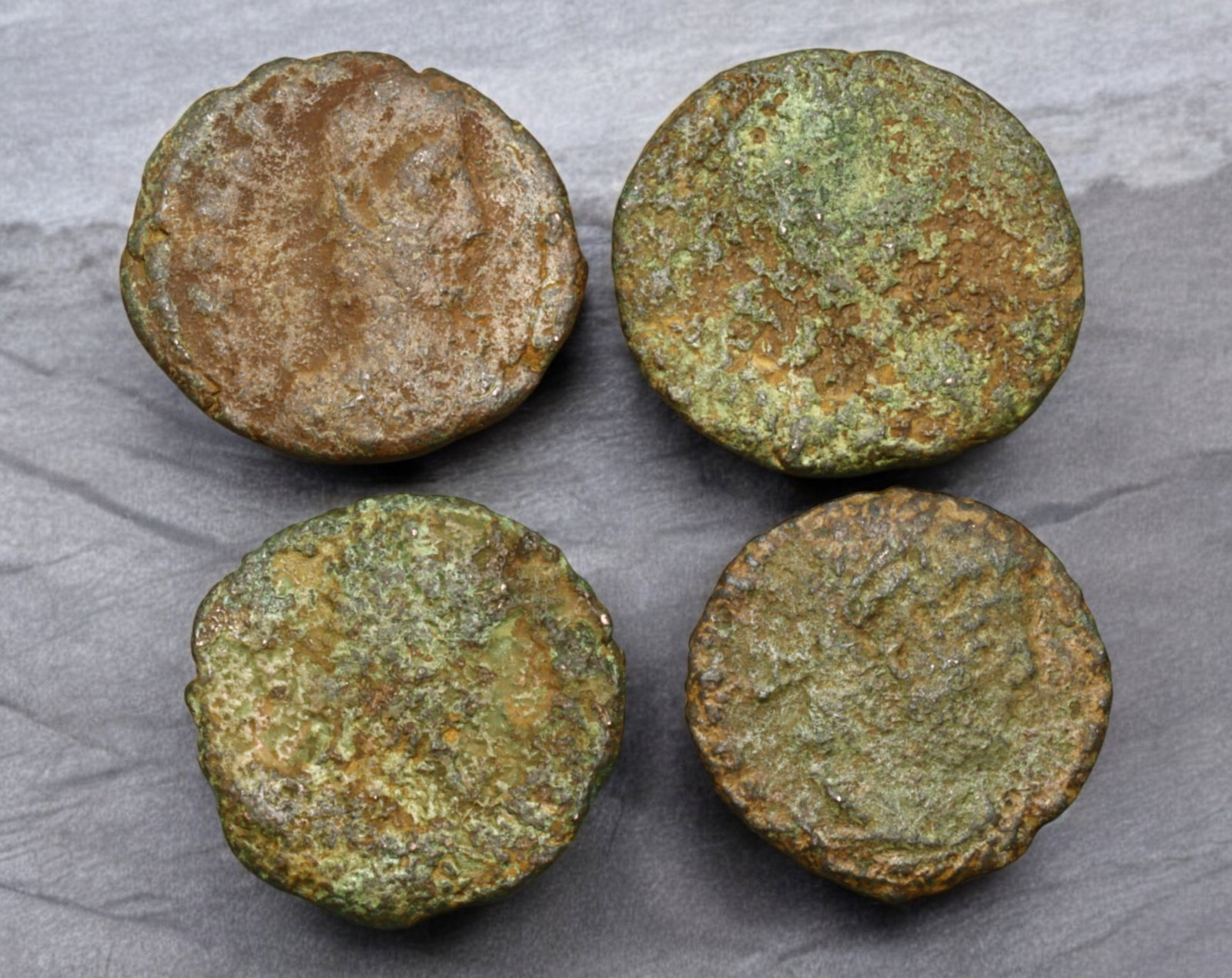 ROMAN EMPIRE: AE Coins - Bronze Issue, 15-17mm, 5.3g, Lot of 4: A lot of bronze coins from the Roman Empire, reflecting the practical monetary fabric of the Imperial economy. These modestly sized bronzes likely span different emperors and issues, underscoring the 