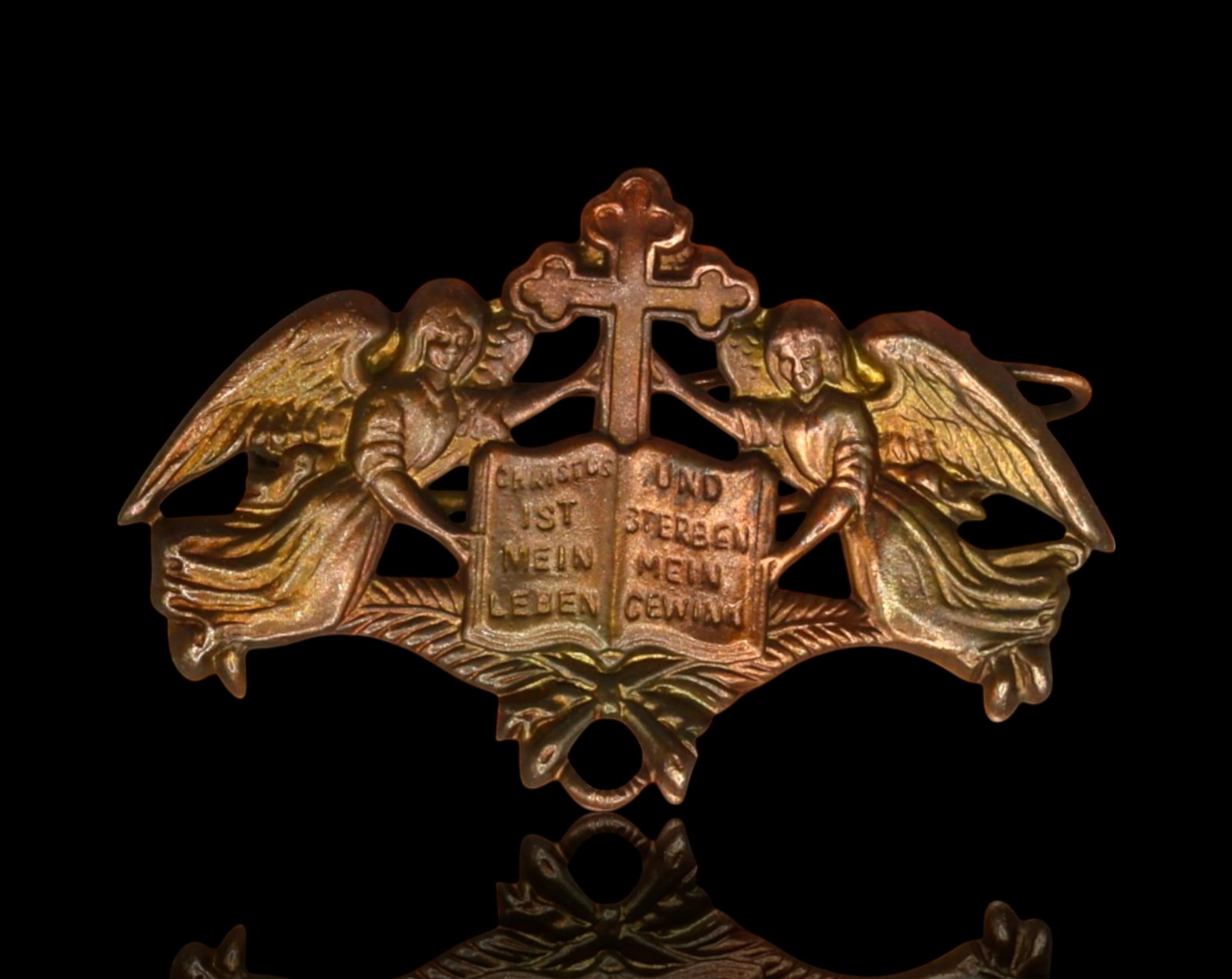 GERMANY: Christian Fraternal Badge - Sacred Heart and Anchor Cross Symbolism: An ornate early 20th-century German Christian badge, featuring a striking arrangement of faith-related symbols. At its center, an open book displays a German inscription referencing Christ?€?s te