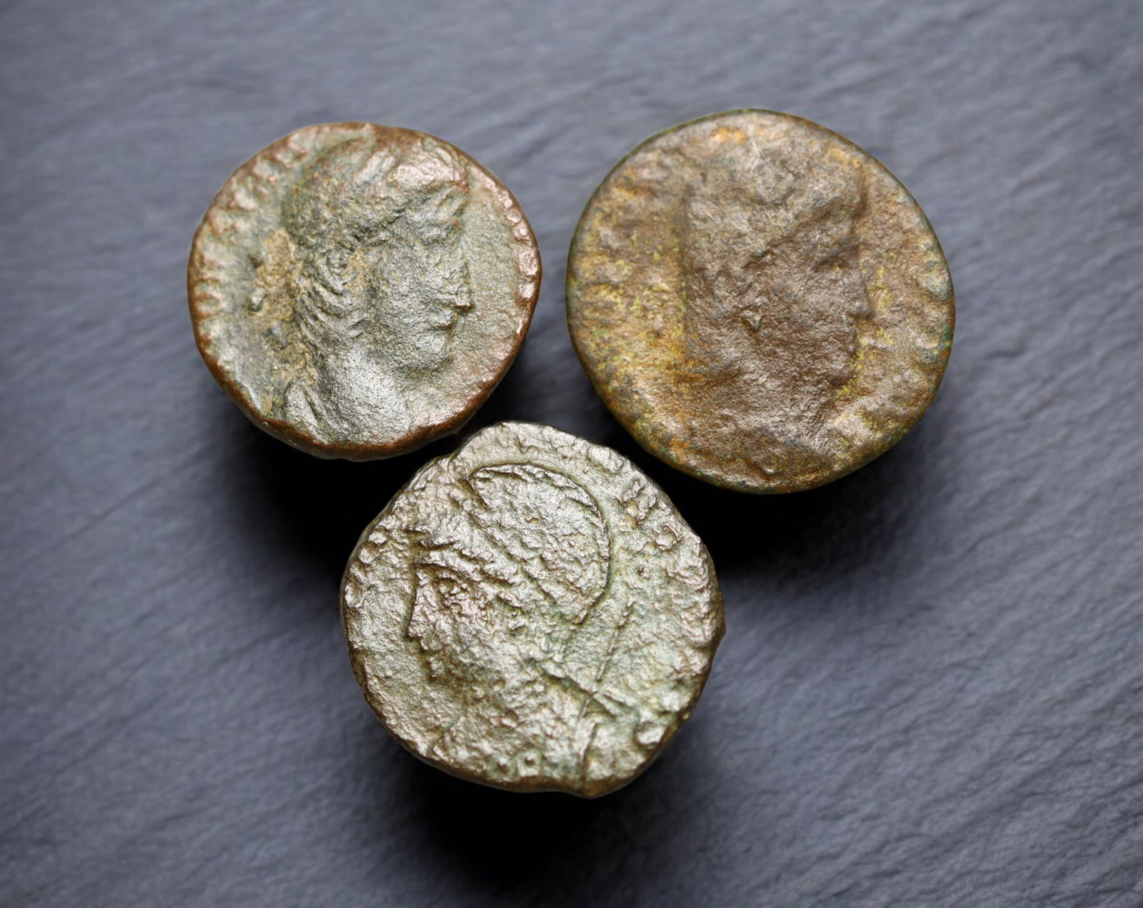 ROMAN EMPIRE: AE Coins - Bronze Issue, 14-15mm, 4.4g, Lot of 3: A lot of bronze coins from the Roman Empire, reflecting the practical monetary fabric of the Imperial economy. These modestly sized bronzes likely span different emperors and issues, underscoring the 