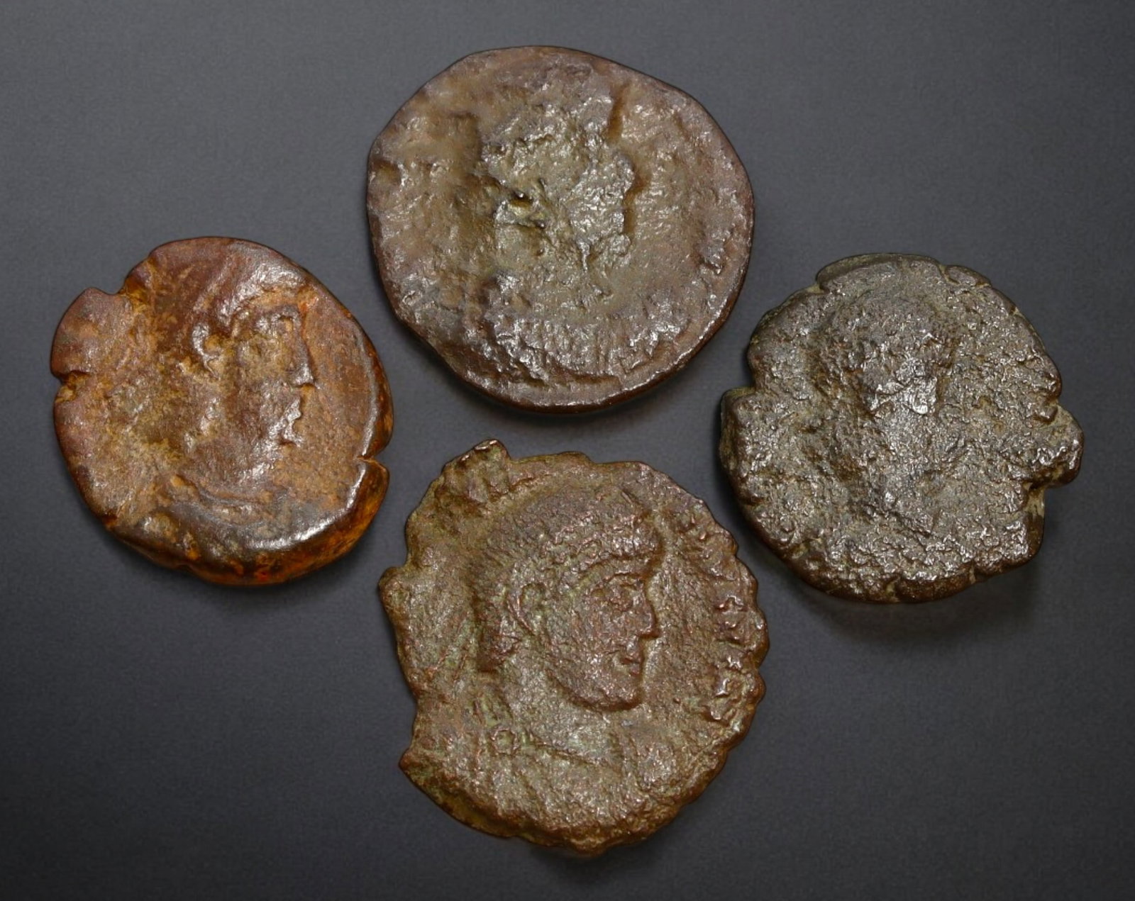 ROMAN EMPIRE: AE Coins - Bronze Issue, 14-16mm, 6.7g, Lot of 4: A lot of bronze coins from the Roman Empire, reflecting the practical monetary fabric of the Imperial economy. These modestly sized bronzes likely span different emperors and issues, underscoring the 