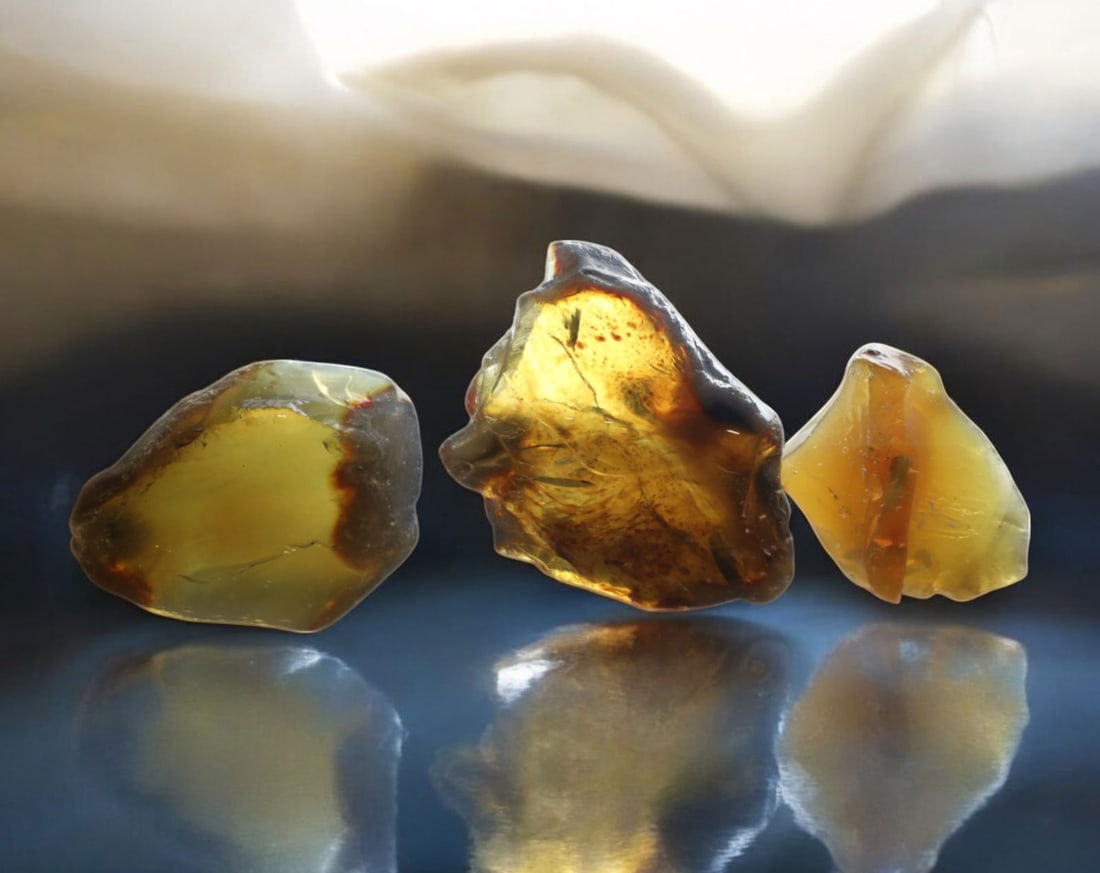 NATURAL: Baltic Amber Specimen Rough - 87g, 5.5-7cm, Fossilized Tree Resin: A stunning set of raw Baltic amber specimens, these unpolished pieces display rich golden hues with deep brown inclusions, characteristic of high-quality fossilized tree resin. The translucency and na