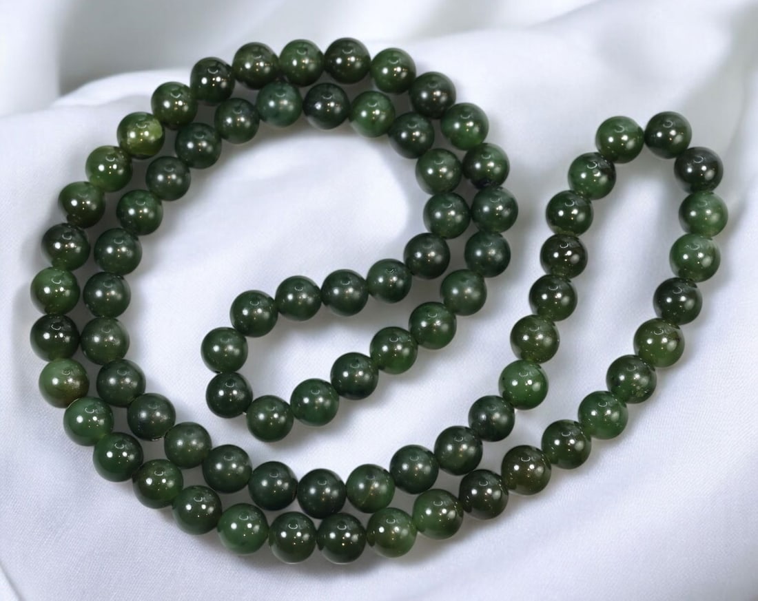VINTAGE: Polished Green Jade Bead Necklace - Possibly Nephrite, 76cm, 125g: A beautifully crafted vintage beaded necklace featuring polished deep green jade stones, possibly nephrite. Measuring approximately 76cm in length and weighing 125g, this elegant piece showcases round
