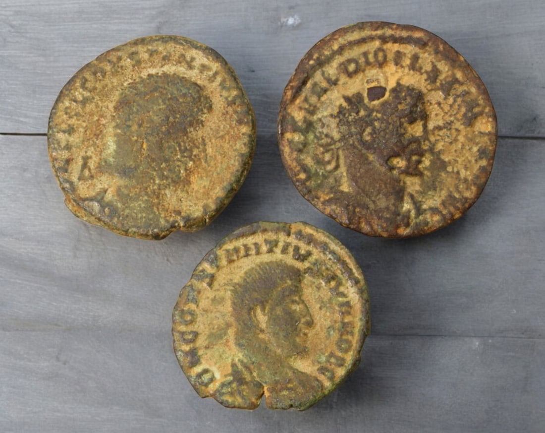 ROMAN EMPIRE: AE Coins - Bronze Coins, 18-20mm, 8.1g (Lot of 3): A collection of ancient Roman bronze coins, each featuring a distinct imperial portrait on the obverse and various symbolic or military-themed reverses. These coins, essential to Roman commerce and go