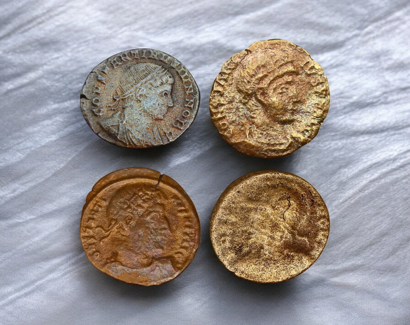 ROMAN EMPIRE: Lot of 4 Late Roman Bronze AE Coins 15-18mm, c. 3rd-5th Century AD: A mixed lot of four late Roman bronze AE coins, representing the turbulent era of the later empire. These coins likely feature emperors from the 3rd to 5th centuries AD, a period marked by military cr