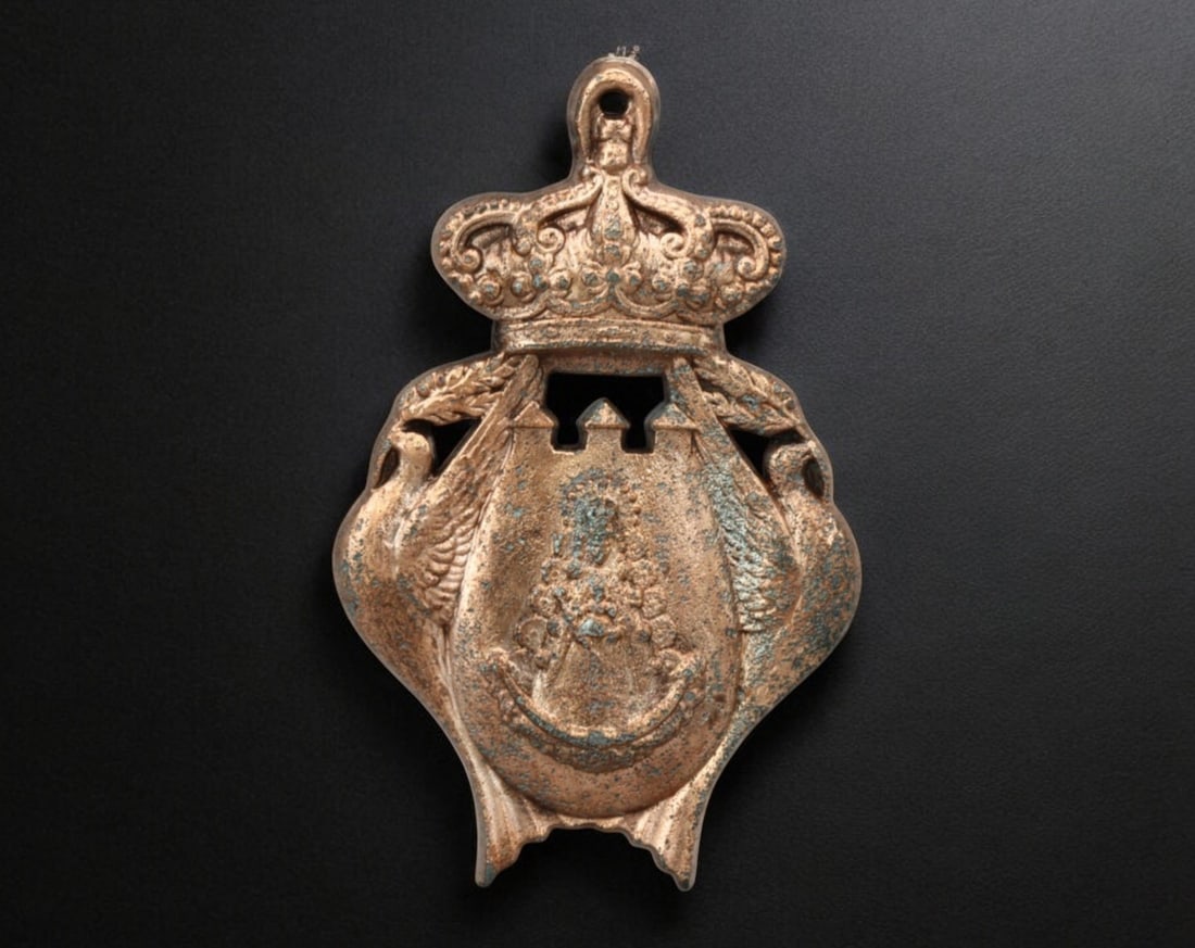 SPAIN: Devotional Badge - Our Lady of the Forsaken, 19th Century: A finely crafted bronze devotional badge measuring 8.2cm and weighing 58g, featuring an intricate depiction of Our Lady of the Forsaken (Nuestra Se?ora de los Desamparados), the revered patroness of V