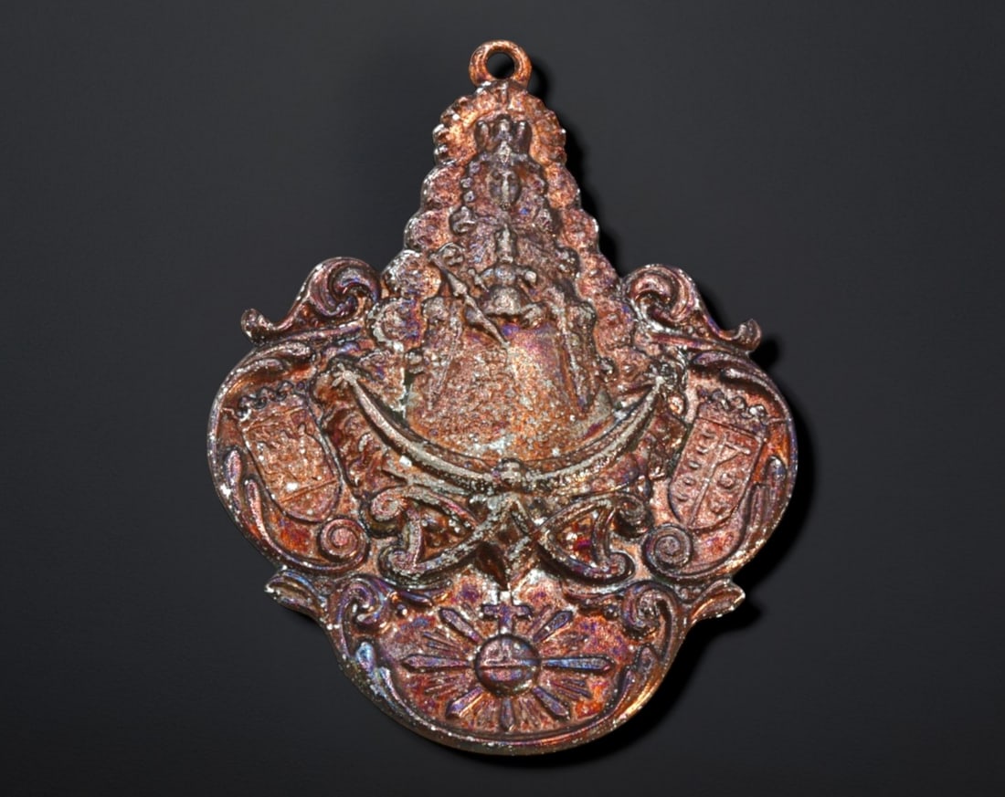 SPAIN: Virgen del Rocio Brotherhood Medal - Bronze, 19th-20th Century: A beautifully detailed bronze devotional medal, measuring 7.5x5.8 cm and weighing 50g, honoring the Virgen del Rocio. The ornate design features the crowned Virgin at the center, flanked by heraldic s