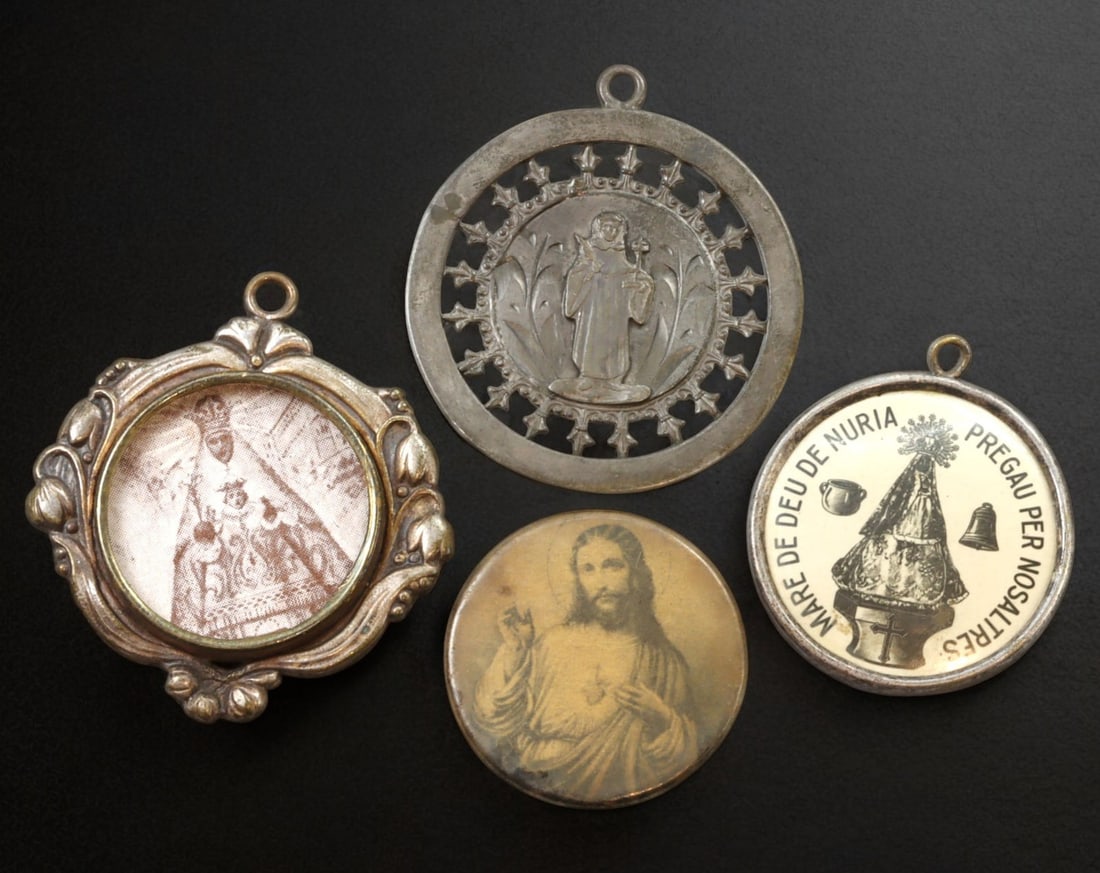 SPAIN: Devotional Medal Group - Mare de Deu de Nuria & Sacred Heart, ca. 1940s-60s: Charming group of four religious medallions, all depicting venerated Christian imagery with origins in Spain. The collection includes a scenic enameled image of the Santuari de la Mare de Deu de Nuria