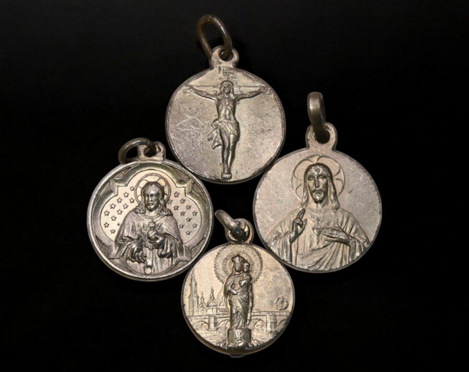 EUROPE: Set of 4 Religious Medals - Sacred Heart, Virgin Mary & Crucifixion, Silvered Base Metal: An elegant collection of four religious medals, struck in silvered base metal, with diameters ranging from 1.7 to 1.9 cm and a total weight of 6.4g. Each medal features finely detailed Christian icono