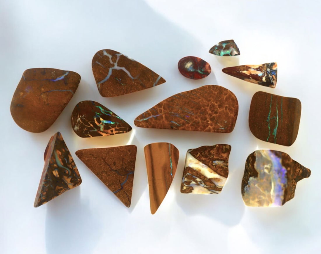 AUSTRALIA: Matrix Boulder Opal Preform Rough Lot, 20g, 0.5-2.5cm Each: A stunning selection of matrix boulder opal rough, sourced from Australia's renowned opal fields in Queensland. These preform-cut rough specimens display vivid flashes of blue, green, and purple opale