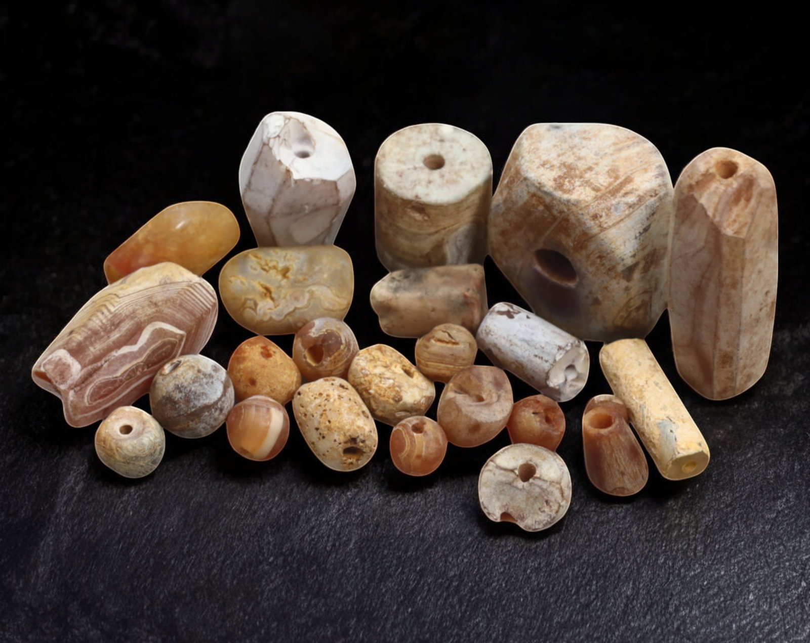 ANCIENT: Agate & Carnelian Beads - 5-35mm, 60g: An exquisite assortment of ancient agate and carnelian beads, dating back to antiquity, showcasing a variety of earthy hues, intricate banding, and natural weathering. These beads, exhibit varied shap