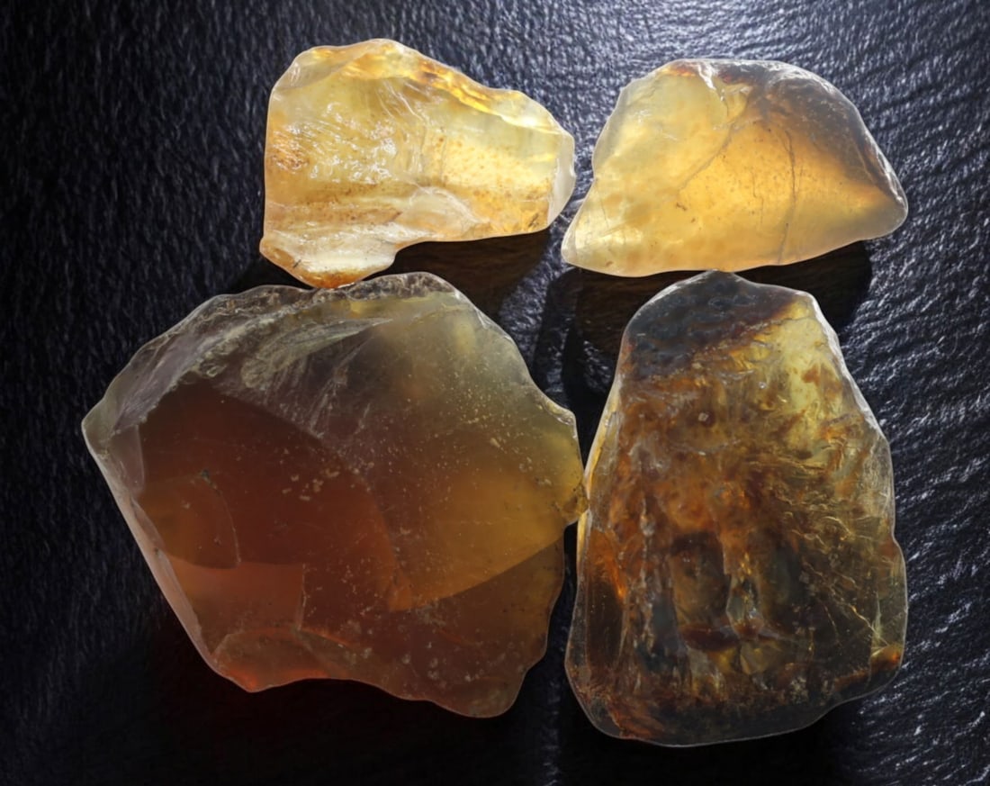 NATURAL: Baltic Amber Specimen Rough - 48g, 3-4.5cm, Fossilized Tree Resin: A stunning set of raw Baltic amber specimens, these unpolished pieces display rich golden hues with deep brown inclusions, characteristic of high-quality fossilized tree resin. The translucency and na