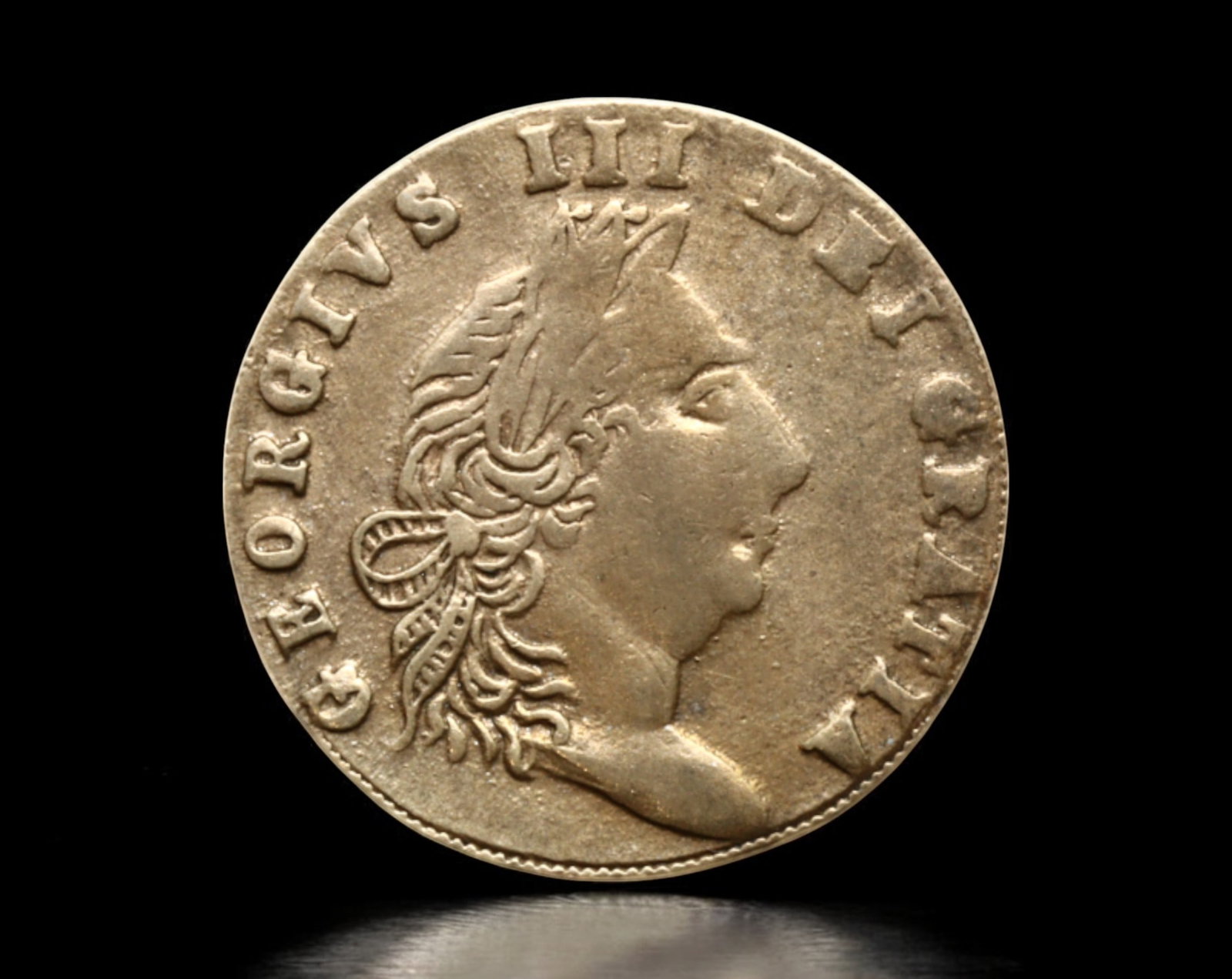 GREAT BRITAIN: George III "In Memory of the Good Old Days" Token, 1768: An intriguing political and satirical token struck in 1768 under the reign of King George III, measuring 22mm in diameter and weighing 2g. The obverse presents a crude portrait of George III with the 