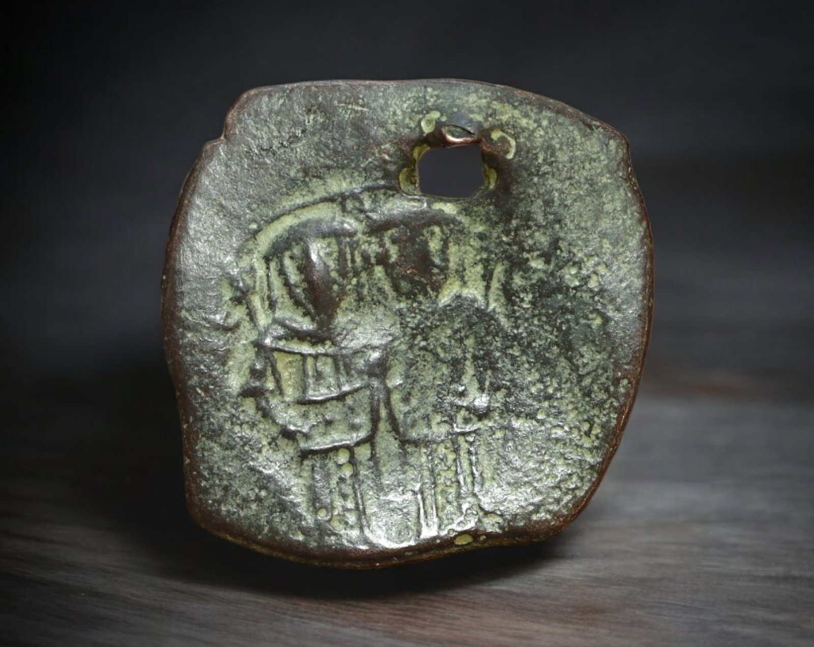 BYZANTINE EMPIRE: Constans II - AE Follis Coin, ca. 641-668 (21mm, 2.8g): Struck under Emperor Constans II during the mid-7th century, this bronze follis features the stylized standing figures of the emperor and his sons, with their distinctive military attire faintly visib