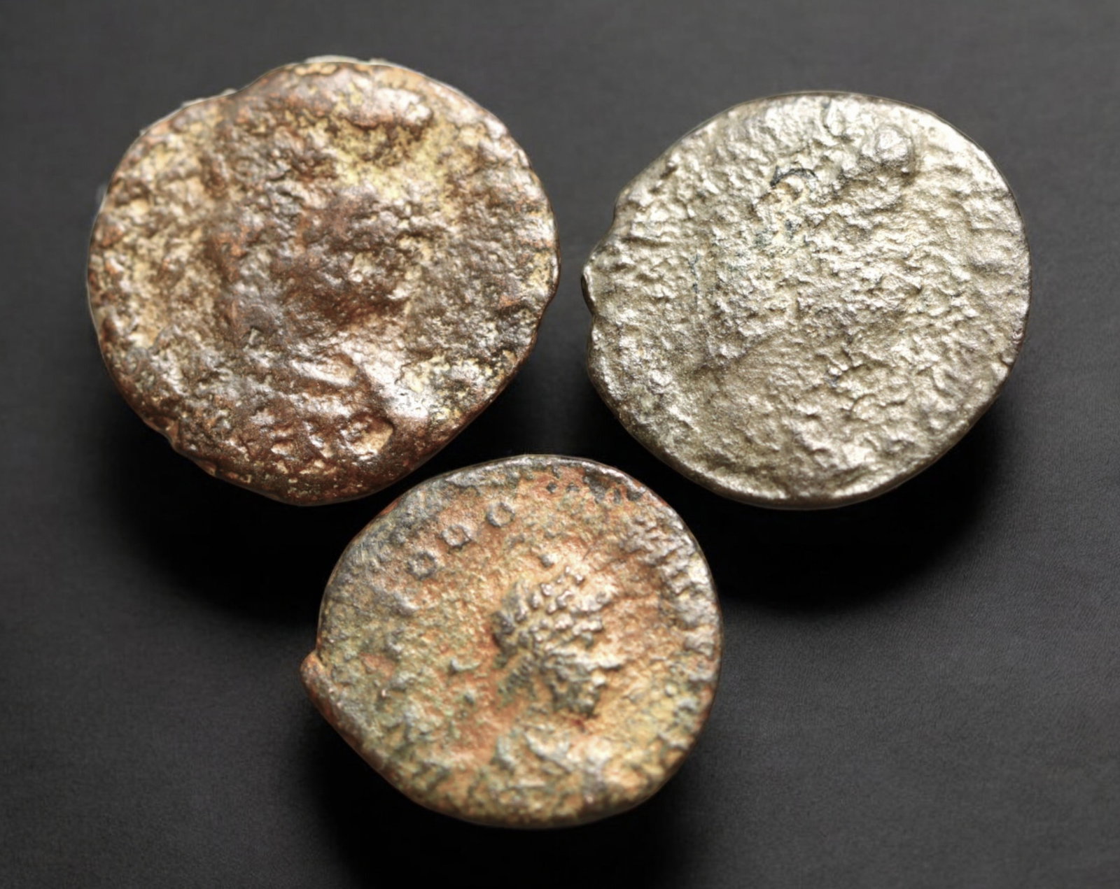 ROMAN EMPIRE: AE Coins - Bronze Issue, 14-16mm, 3.2g, Lot of 3: A lot of bronze coins from the Roman Empire, reflecting the practical monetary fabric of the Imperial economy. These modestly sized bronzes likely span different emperors and issues, underscoring the 