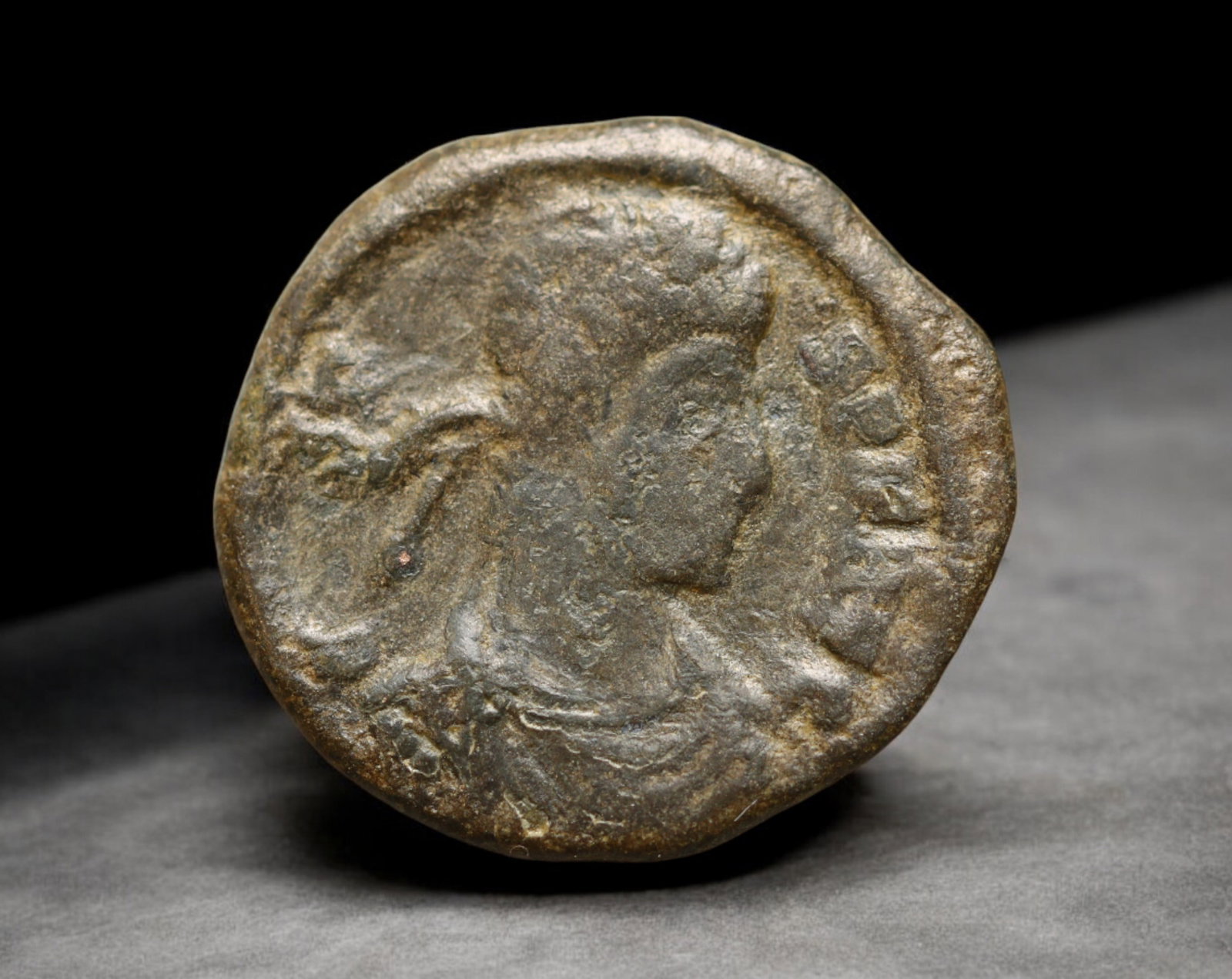 ROMAN EMPIRE: AE Coin - Bronze Issue, 17mm: A diminutive bronze coin from the Roman Empire, emblematic of the empire's evolving monetary system during times of economic transition. As silver reserves dwindled and inflation surged, bronze coinag
