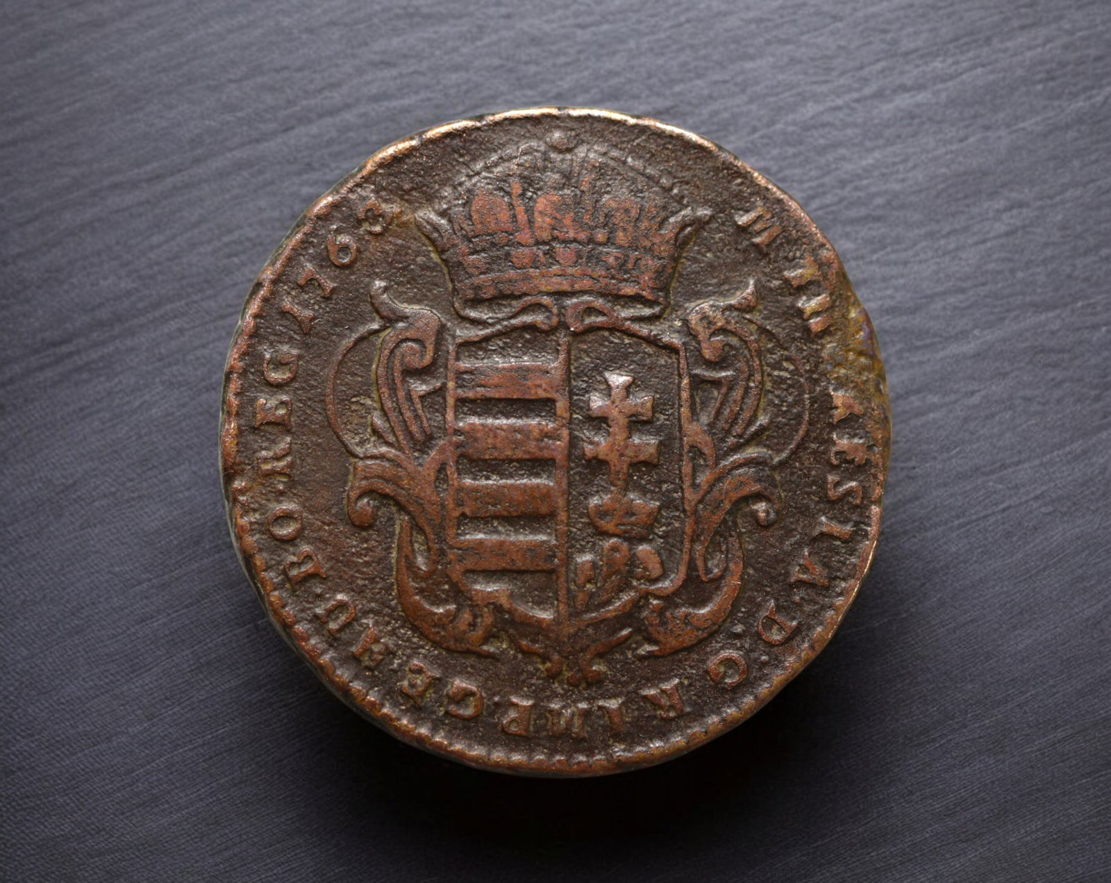 HUNGARY: Maria Theresia - Copper Denar Coin Coin, 1763 (22mm, 5.9g): Struck in 1763 during the reign of Empress Maria Theresia, this copper Denar Coin displays the crowned Hungarian arms on one side, encircled by an abbreviated Latin legend attesting to her royal title