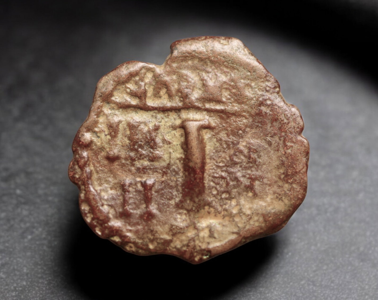 BYZANTINE EMPIRE: Anonymous Folles Type - AE Tetarteron Coin, ca. 10th-11th Century (17mm, 1.3g): This lightweight Byzantine tetarteron coin features the iconic large "M" flanked by Greek letters, symbolizing the denomination of 40 nummi. The visible cross above the "M" and the faint remnants of t