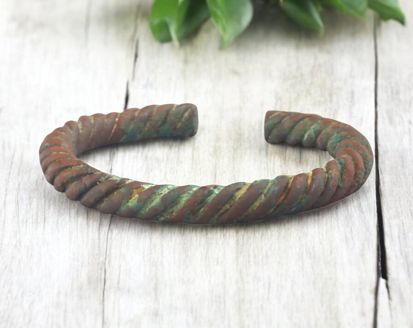 WEST AFRICA: Igbo Twisted Bronze Currency Bracelet - 19th-20th Century, 8.3x9.6cm, 153g: A beautifully crafted Igbo bronze currency bracelet from Nigeria, measuring 8.3x9.6cm and weighing 153g. This piece features a distinctive twisted rope-like design, a hallmark of Igbo metalworking tra