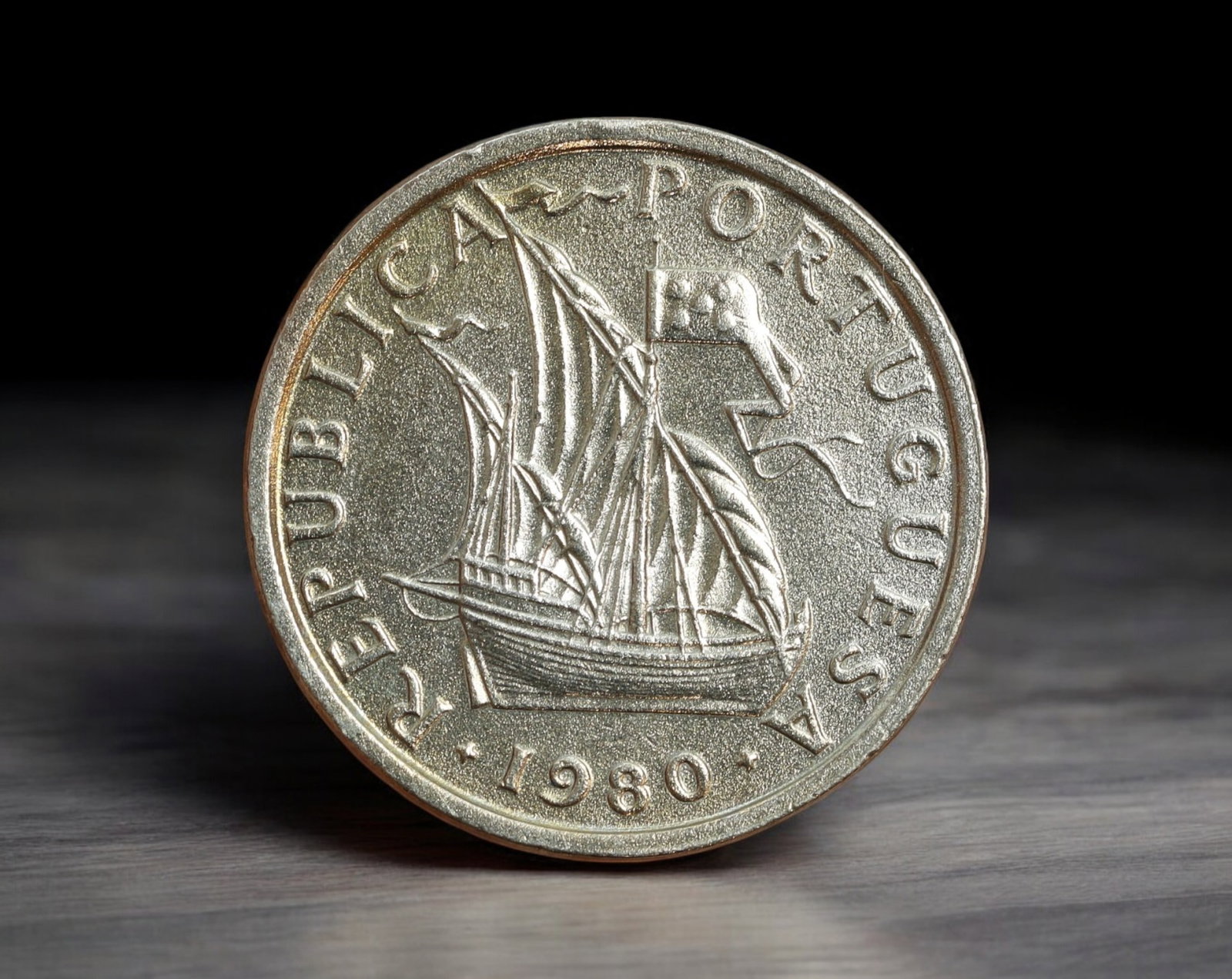 PORTUGAL: Republic - Cupronickel 5 Escudos Coin, 1980 (24mm, 7g): Struck in 1980, this cupronickel 5 Escudos coin celebrates Portugal's rich maritime legacy with a detailed depiction of a 15th-century caravel in full sail-a vessel emblematic of the Age of Discovery.
