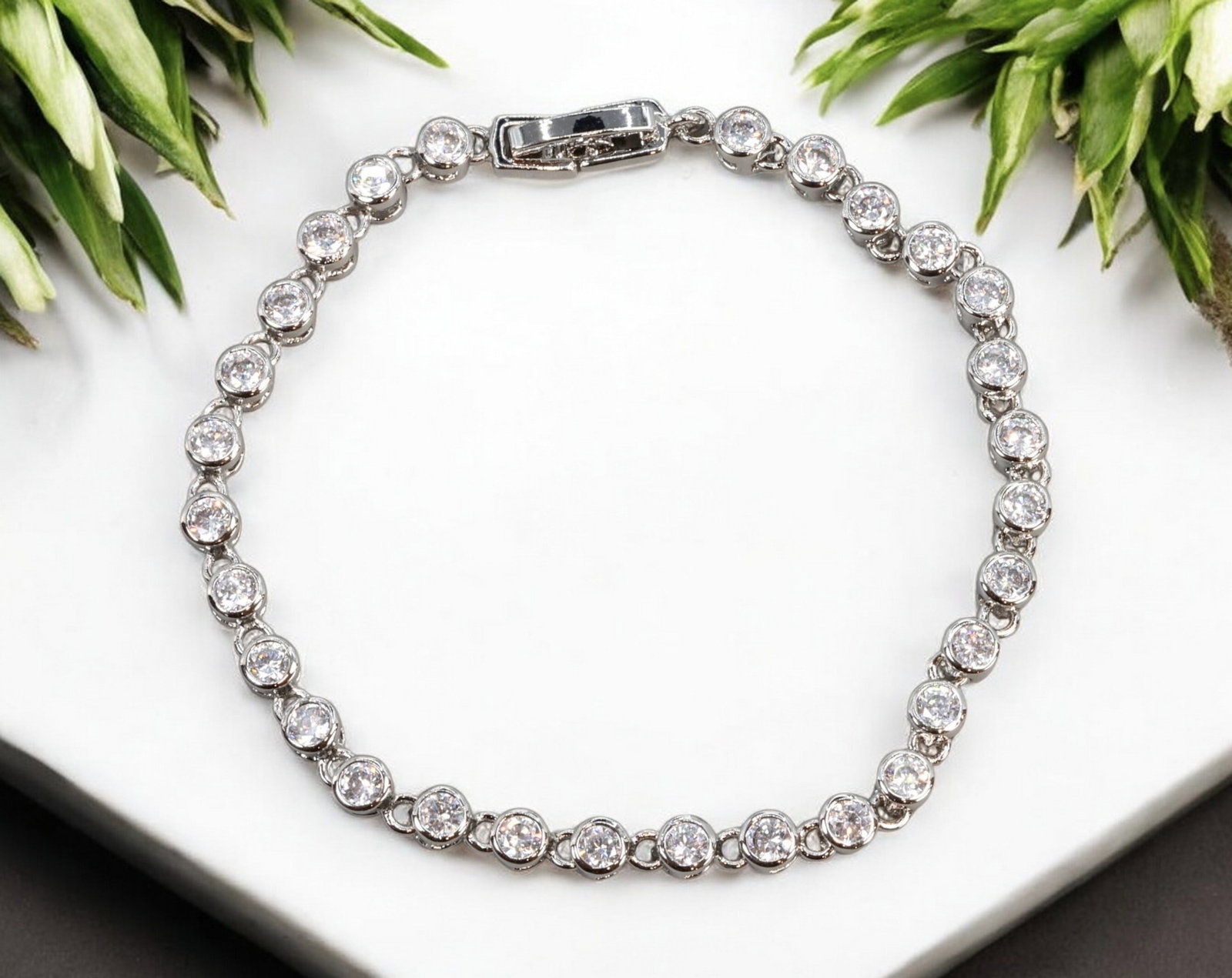 CONTEMPORARY CLASSIC: Tennis Bracelet - Silver-Tone with Bezel-Set Clear Crystals, 17cm (7g): This elegant contemporary tennis bracelet showcases a continuous line of bezel-set clear crystals in a bright silver-tone setting. Measuring 17 cm in length and weighing 7 grams, the bracelet features