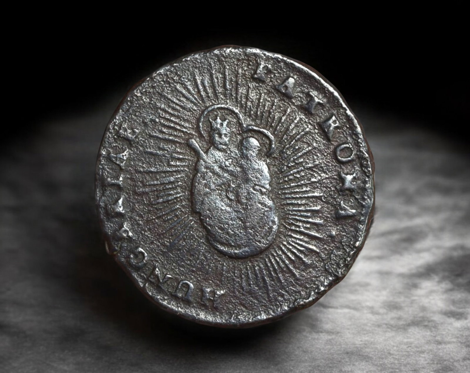 HUNGARY: Maria Theresia - Copper Denar Coin Coin, 1763: This 1763 copper Denar Coin, struck under the reign of Maria Theresia, presents the crowned Madonna and Child radiating divine light on the obverse, surrounded by the inscription PATRONA HUNGARIAE, a 