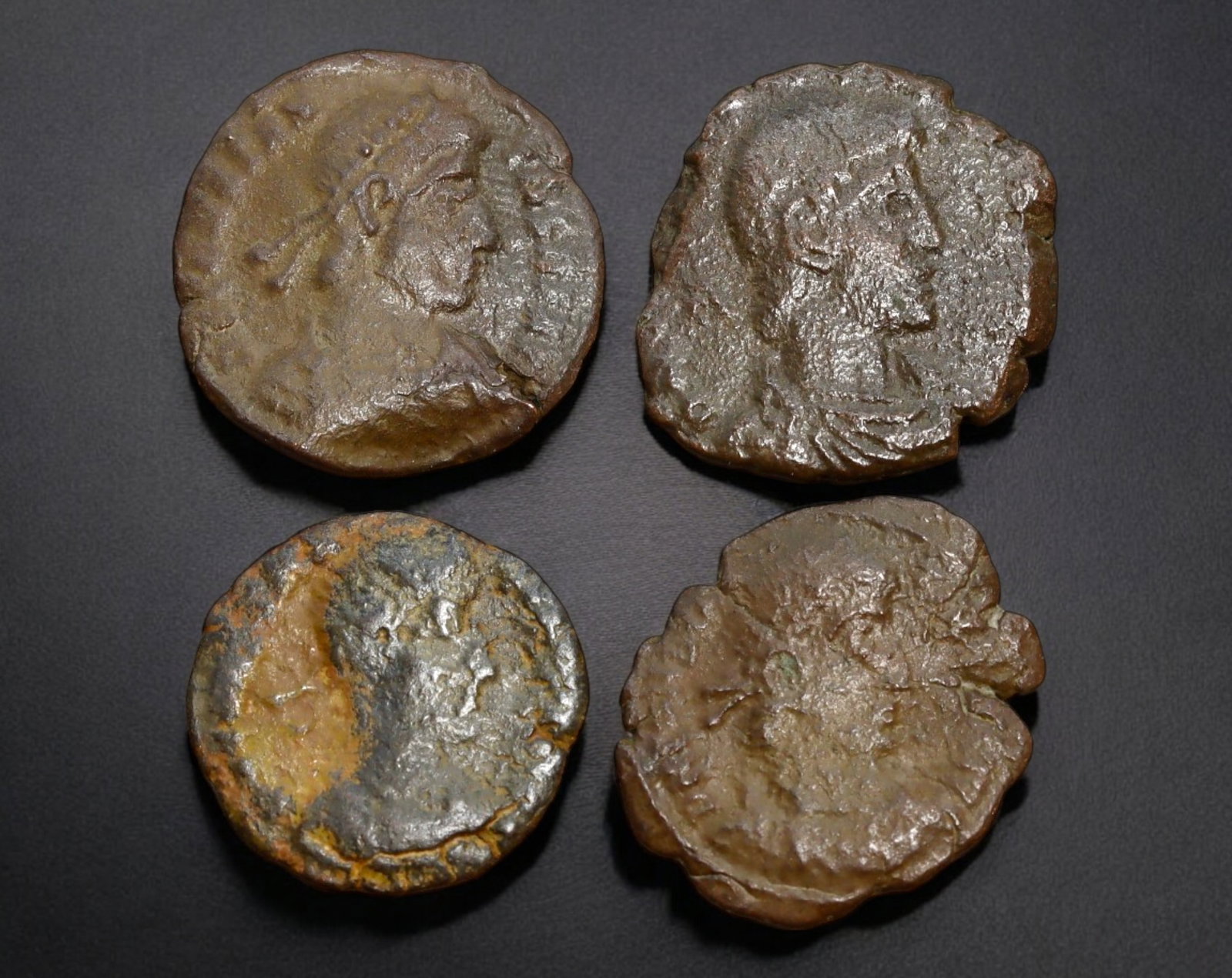 ROMAN EMPIRE: AE Coins - Bronze Issue, 16-18mm, 7.3g, Lot of 4: A lot of bronze coins from the Roman Empire, reflecting the practical monetary fabric of the Imperial economy. These modestly sized bronzes likely span different emperors and issues, underscoring the 