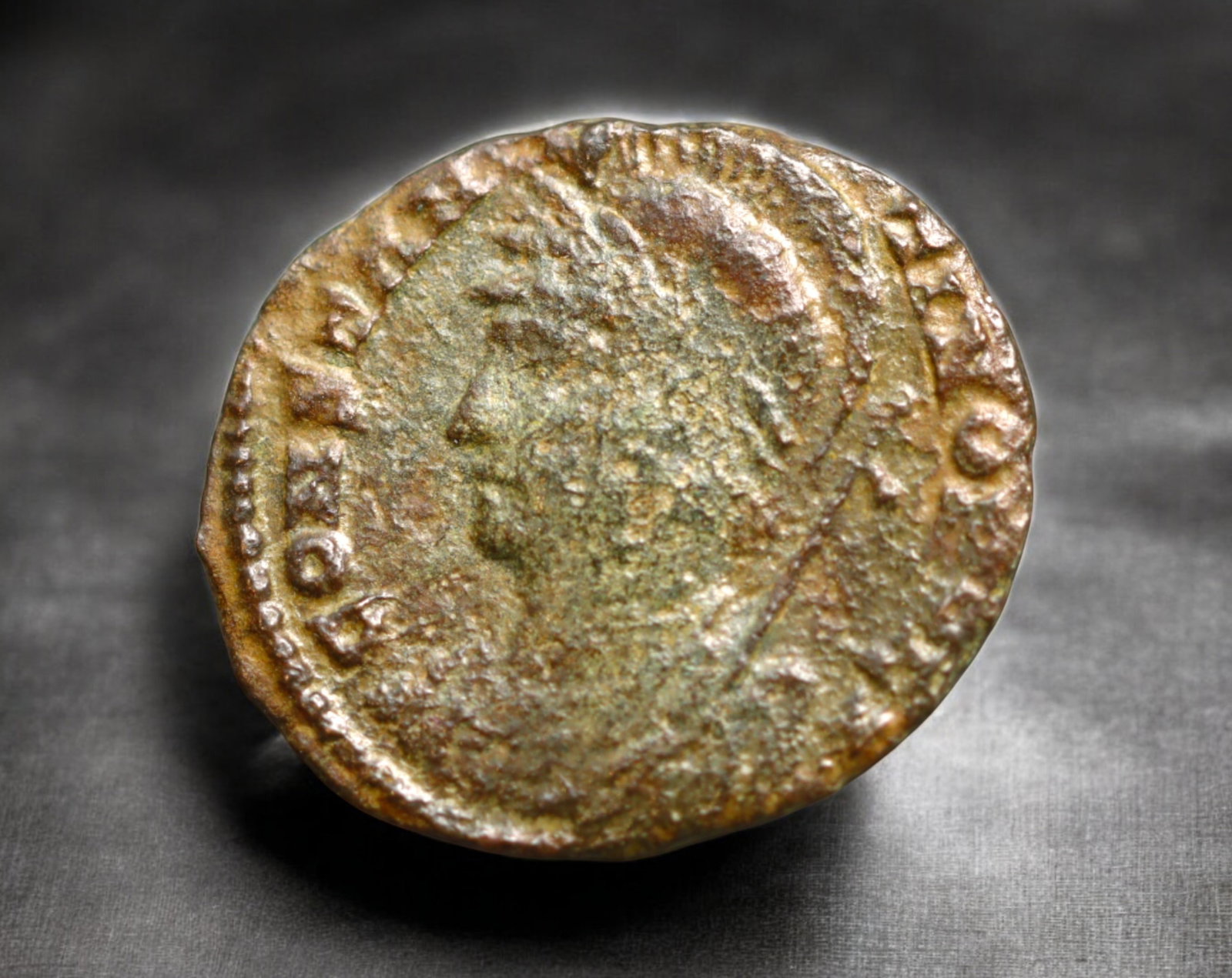 ROMAN EMPIRE: AE Coin - Bronze Issue, 16x18mm, 1.5g: A diminutive bronze coin from the Roman Empire, emblematic of the empire's evolving monetary system during times of economic transition. As silver reserves dwindled and inflation surged, bronze coinag