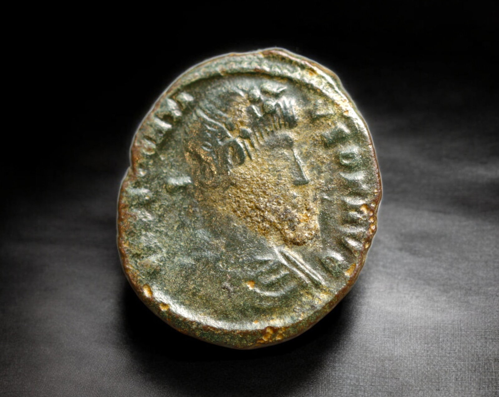 ROMAN EMPIRE: AE Coin - Bronze Issue,15mm, 17, 1.4g: A diminutive bronze coin from the Roman Empire, emblematic of the empire's evolving monetary system during times of economic transition. As silver reserves dwindled and inflation surged, bronze coinag