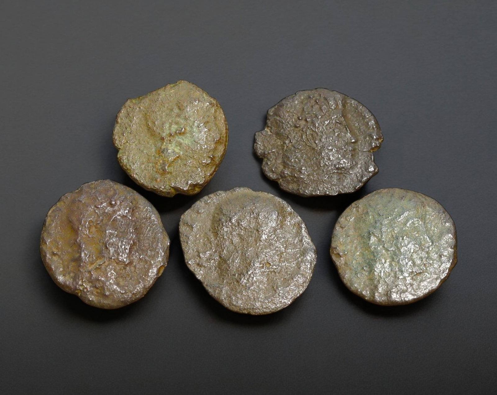 ROMAN EMPIRE: AE Coins - Bronze Issue,12-15mm, 3.7g, Lot of 5: A lot of bronze coins from the Roman Empire, reflecting the practical monetary fabric of the Imperial economy. These modestly sized bronzes likely span different emperors and issues, underscoring the 