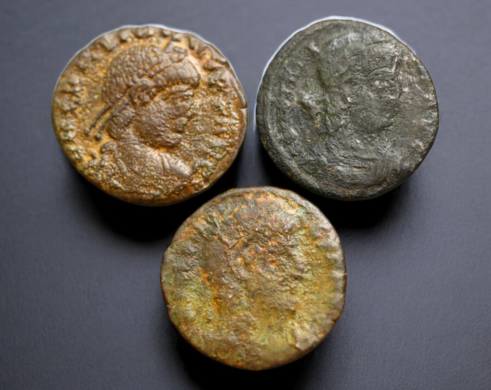 ROMAN EMPIRE: AE Coins - Bronze Issue, 15-17mm, 4g, Lot of 3: A lot of bronze coins from the Roman Empire, reflecting the practical monetary fabric of the Imperial economy. These modestly sized bronzes likely span different emperors and issues, underscoring the 