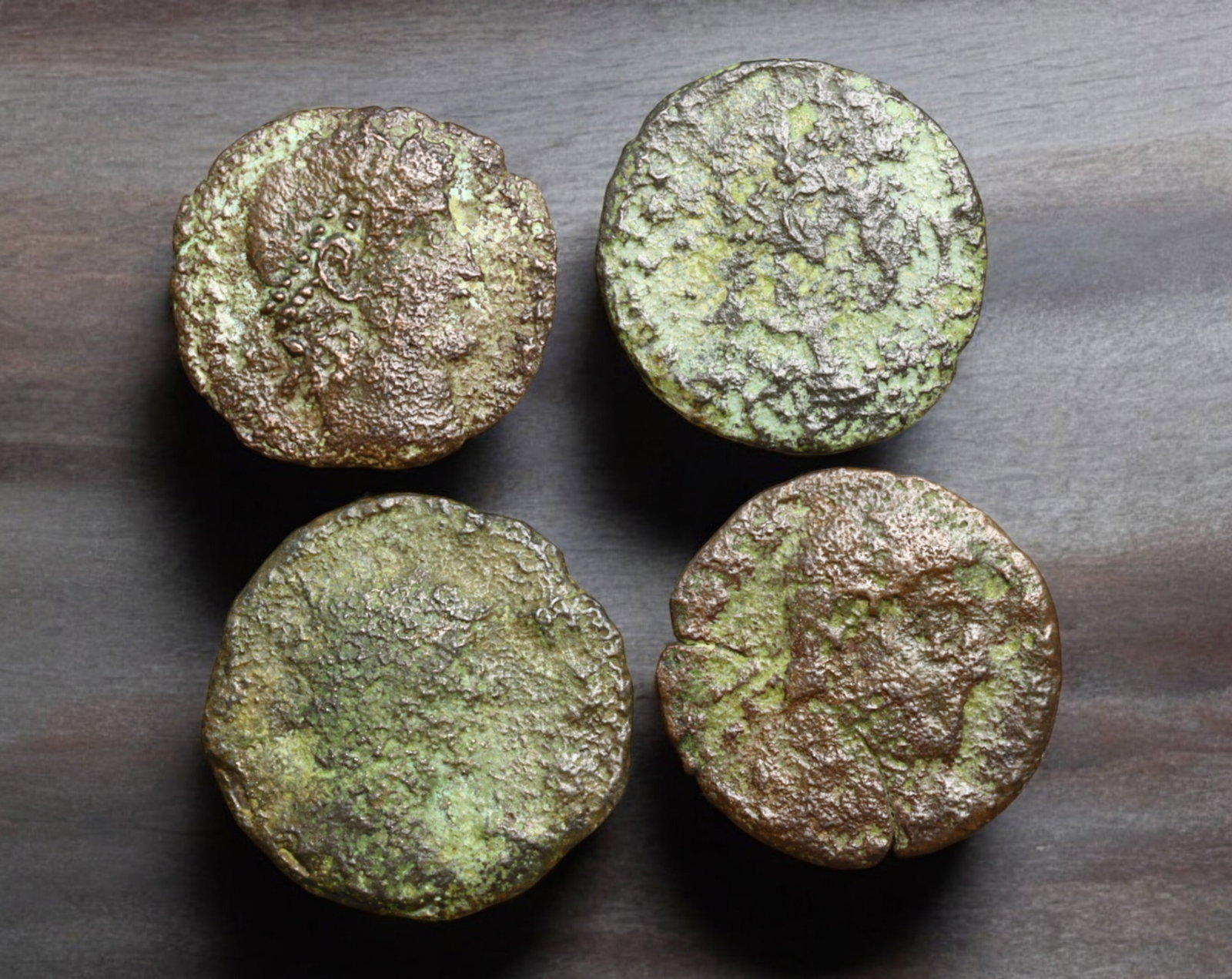 ROMAN EMPIRE: AE Coins - Bronze Issue, 15-16mm, 4.9g, Lot of 4: A lot of bronze coins from the Roman Empire, reflecting the practical monetary fabric of the Imperial economy. These modestly sized bronzes likely span different emperors and issues, underscoring the 