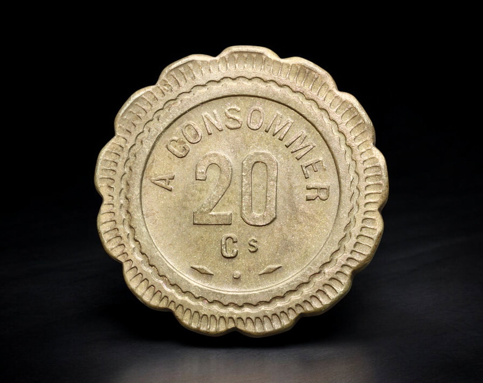 FRANCE: Cafe Token - Brass 20 Centimes "A Consommer" with Stylized 'C' Logo, ca. 1920s-1930s (20mm,: This brass 20 Centimes cafe token features a stylized, incised ''C'' on one side-likely referencing the name of the issuing establishment-paired with the denomination and the phrase A CONSOMMER on the