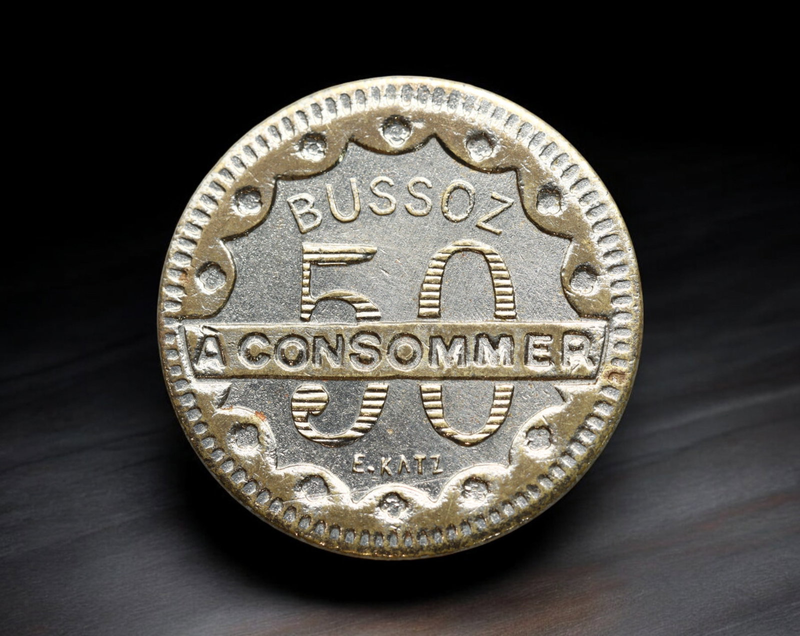 FRANCE: Bussoz - Brass 50 Centimes Coin, E. Katz Design, ca. 1920s (19mm, 2.7g): Produced for the famed Parisian cafe and spirits manufacturer Bussoz, this 50 Centimes brass token showcases a bold Art Deco aesthetic with large vertical numerals bisected by a horizontal ''A CONSOMM
