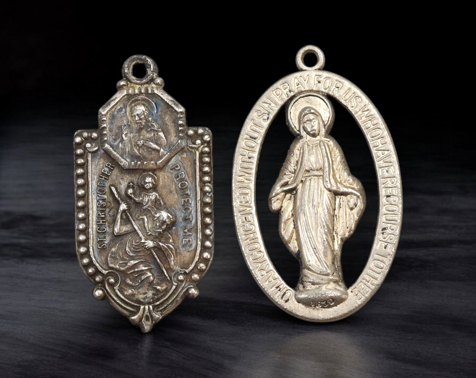 CATHOLIC DEVOTIONAL: Pair of Medals - Silver-Tone St. Christopher & Miraculous Mary, 3.5cm (9.6g: A pair of mid-century Catholic devotional medals in silver-tone metal, featuring highly detailed relief and symbolic inscriptions. The first medal bears the image of St. Christopher carrying the Chris