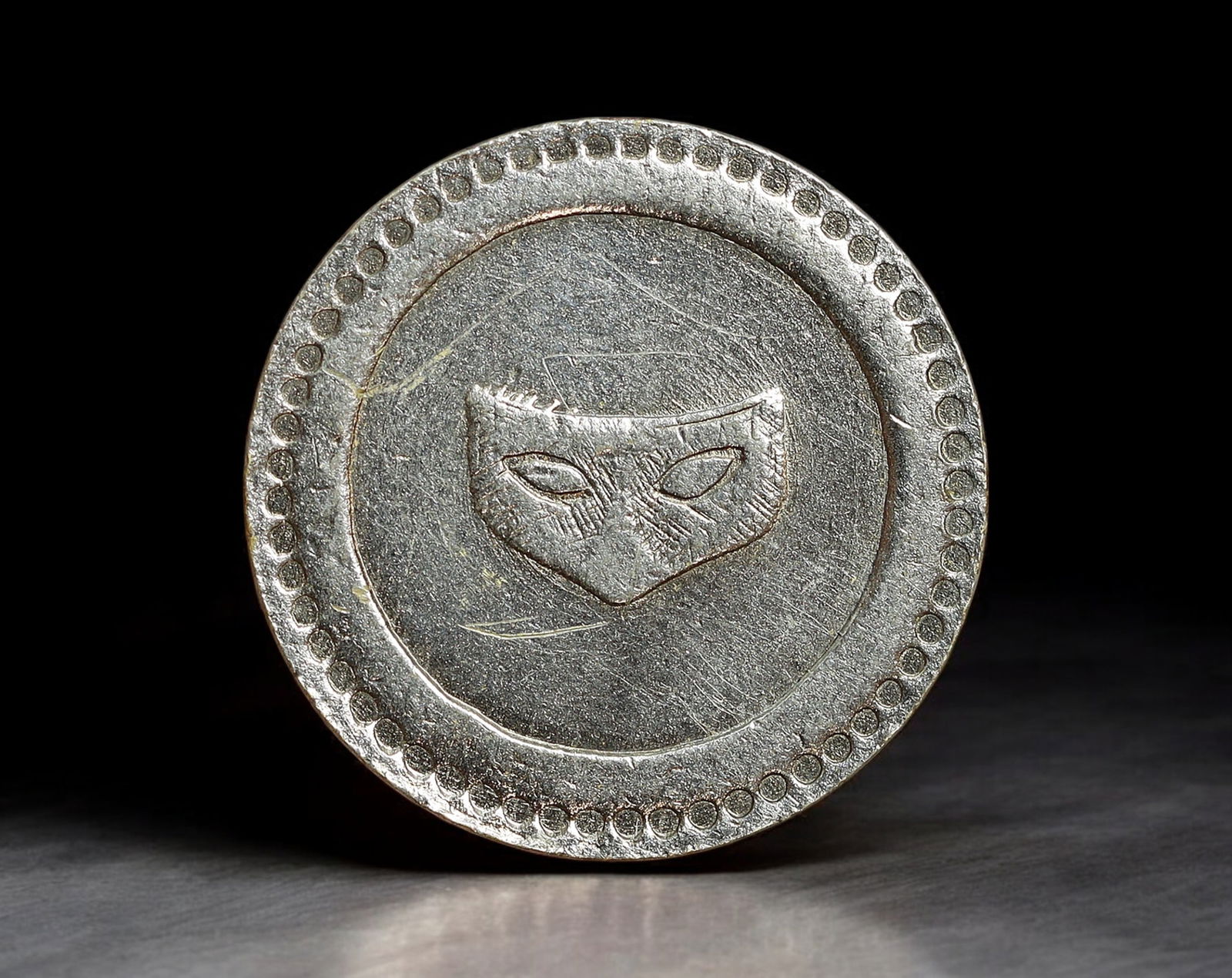 FRANCE: Mask Design Token - A Consommer 10 Centimes Coin, c.1930s (18mm, 2.5g) (1 of 2)