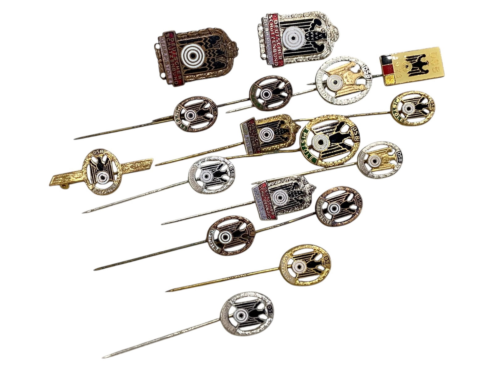 GERMAN DSB SHOOTING BADGES: Stick Pins & Lapel Awards - Luftpistole & Rifle Marks, 18pcs (3-5.5cm): This 18-piece set of vintage stick pins and lapel badges features official insignia from the Deutscher Sch?tzenbund (DSB)-Germany's national shooting federation. These awards were issued to recognize 