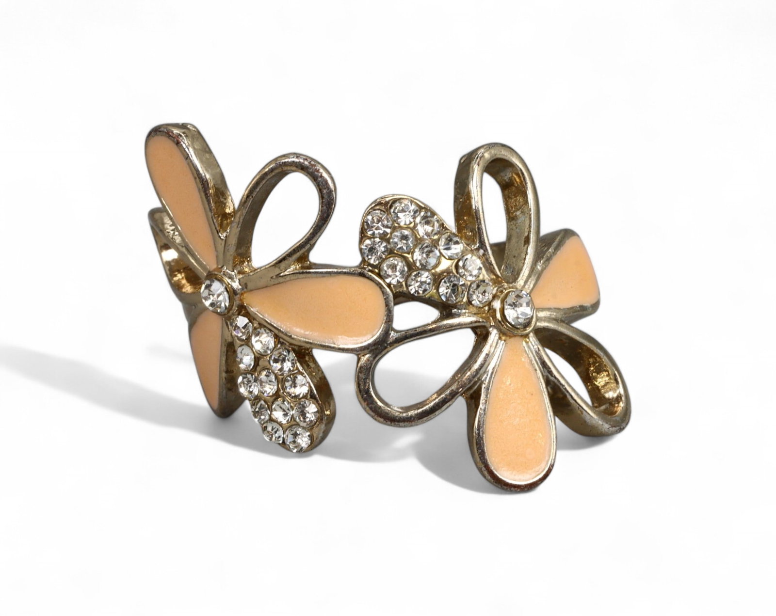 RETRO PLAYFUL STYLE: Double Flower Ring - Peach Enamel and Clear Stones, Goldtone Setting, Size US 8: Capturing the whimsy of retro styling, this double-flower ring features two stylized blooms, each accented with soft peach enamel petals and brilliant-cut clear stones. The goldtone setting enhances t