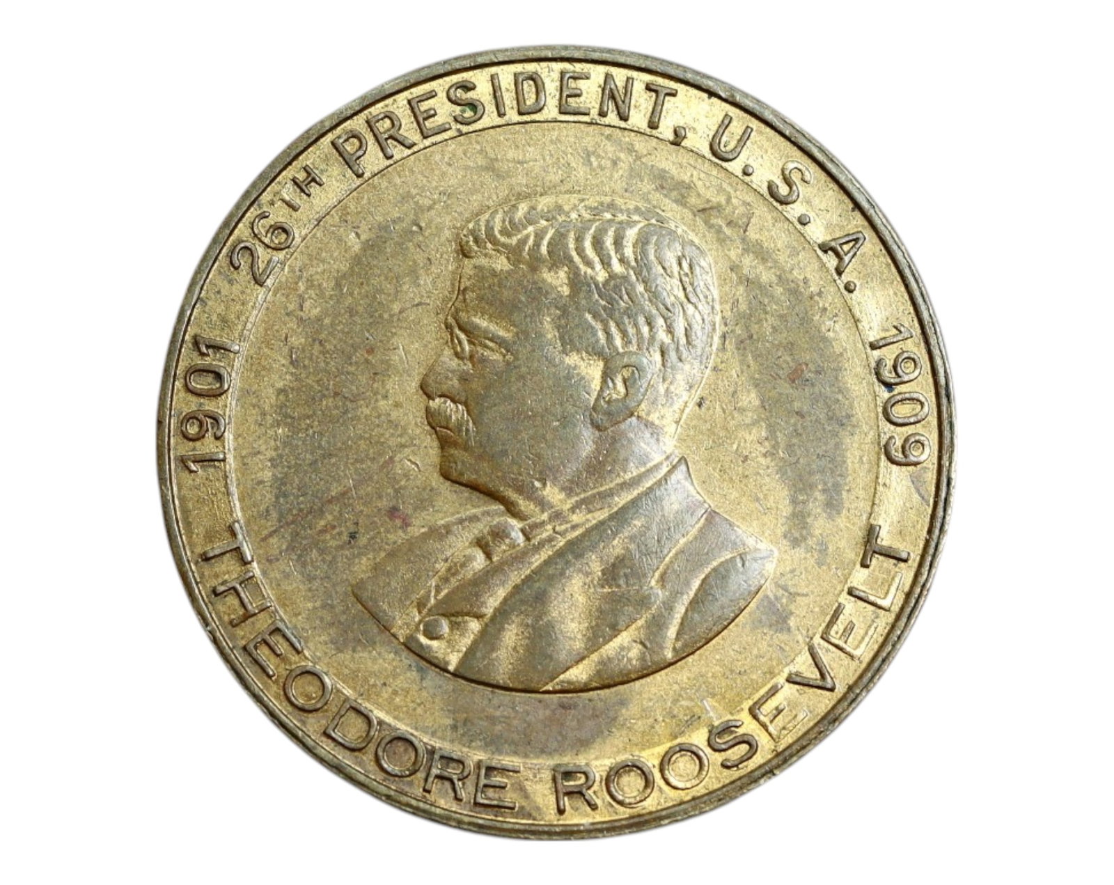 UNITED STATES: Theodore Roosevelt - Bronze Presidential Medal, 1901-1909 (26mm): Struck in homage to one of the most iconic figures of the Progressive Era, this 26mm bronze medal features a left-facing portrait of Theodore Roosevelt, framed by the inscription '26th President U.S.A