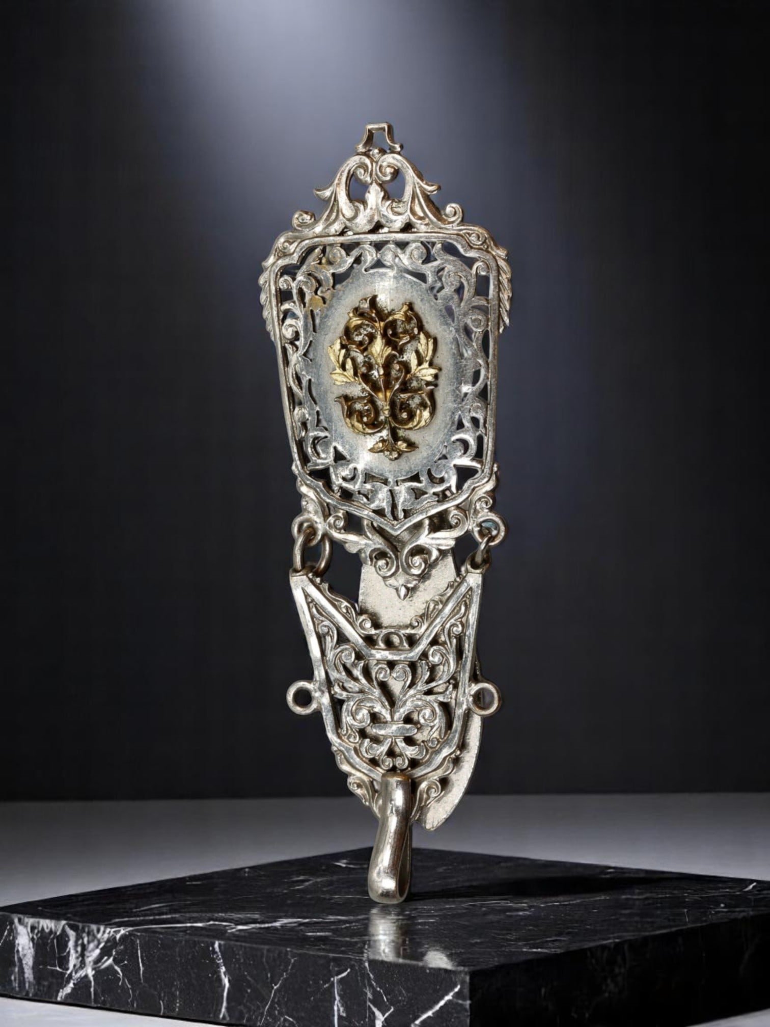 ART NOUVEAU REVIVAL: Filigree Belt Hook - Silver-Tone with Gilded Floral Emblem (16.6g, 8x3cm): An elegant Art Nouveau Revival belt hook featuring ornate silver-tone filigree work with an inset gilded floral motif. The intricate openwork frame is accented by sinuous scrolls and botanical themes,