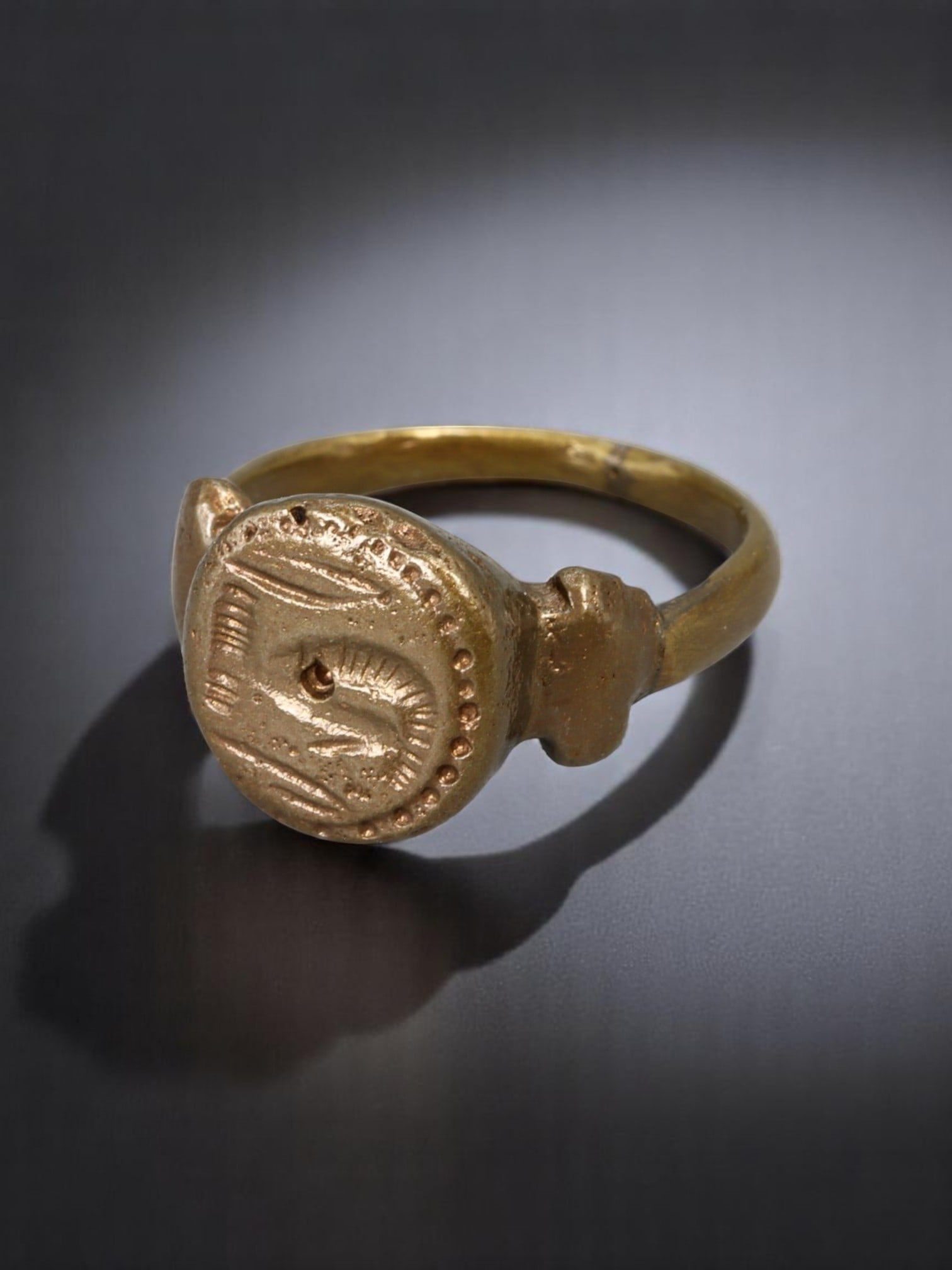 MEDIEVAL ERA: Bronze Signet Ring - Intaglio-Cast Oval Bezel with Symbolic Markings, Size 8.5: An authentic artifact of medieval personal adornment, this estate bronze signet ring features a cast oval bezel with faint intaglio-style impressions-likely once used for marking wax or soft clay. The
