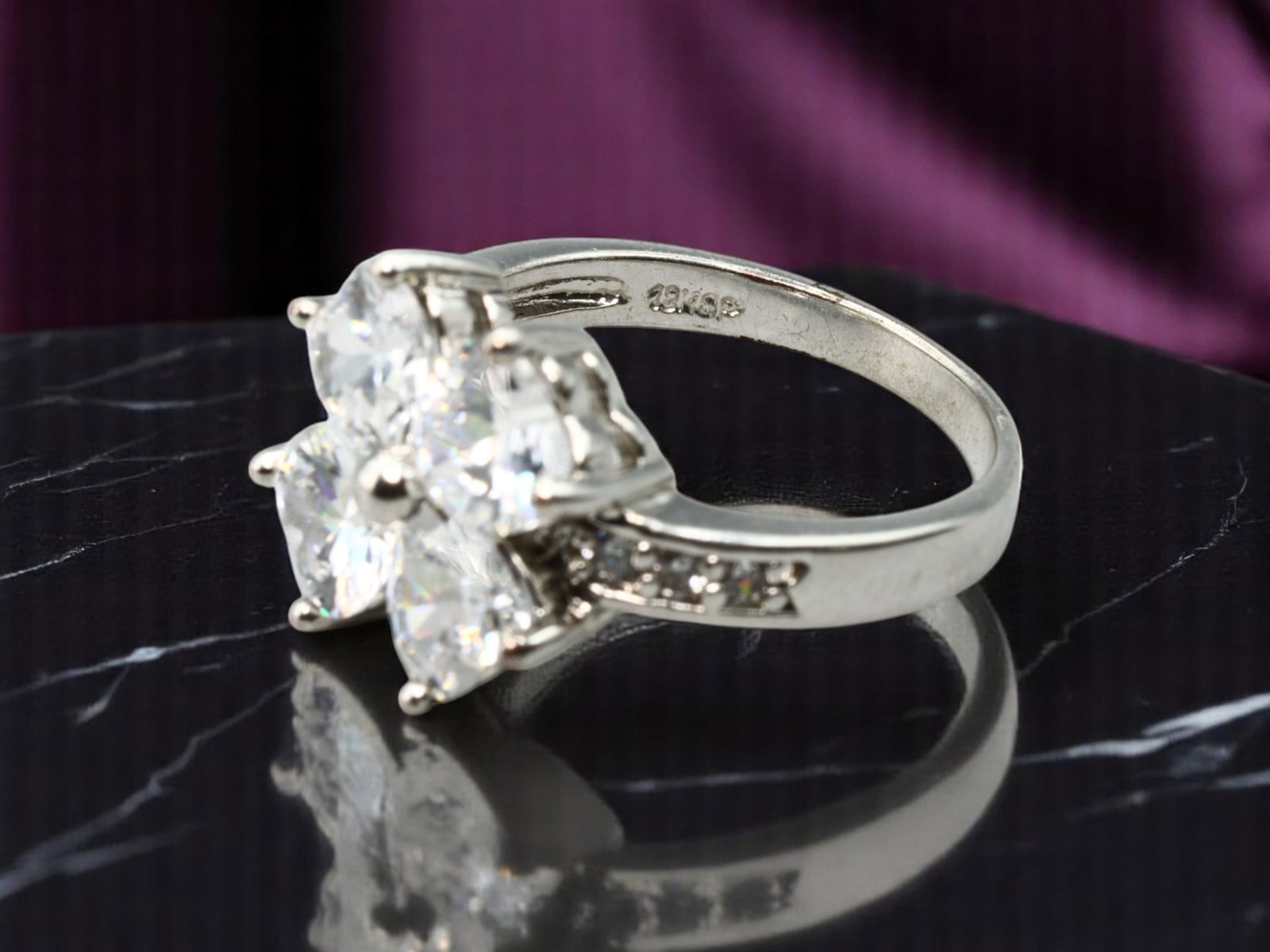 BOLD STATEMENT ERA: Cluster Ring - Brilliant-Cut Clear Stones in 18KGP Setting, Size 7 US: Estate Jewelry with dazzling clarity, this size 7 cluster ring features five faceted clear stones arranged in a floral-like burst, each prong-set to accentuate lightplay and dimension. The shoulders a