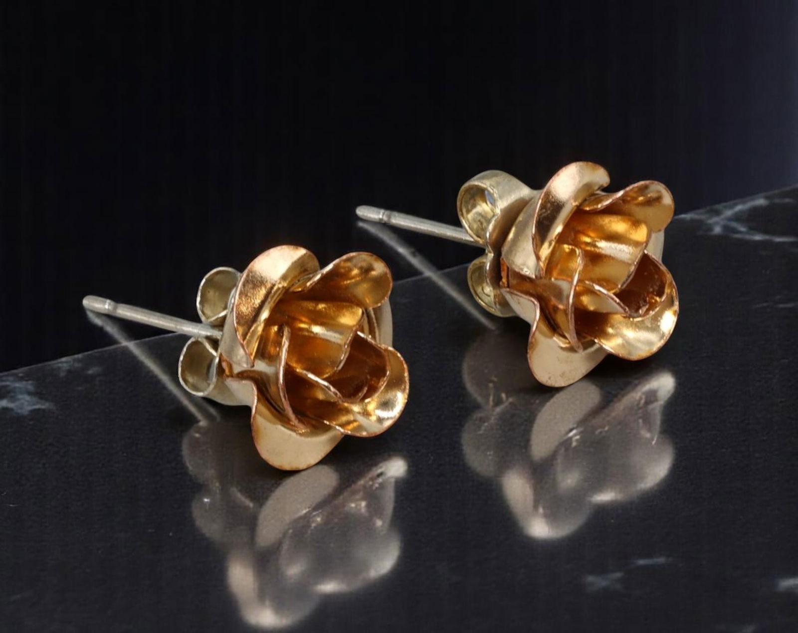 VINTAGE: Rose Stud Earrings - Sculpted Petal Design in Warm Goldtone, 1cm: Estate Jewelry with romantic charm, these vintage stud earrings feature delicately layered rosebud forms crafted in polished goldtone. Measuring 1cm, each earring captures the dimensional beauty of bl