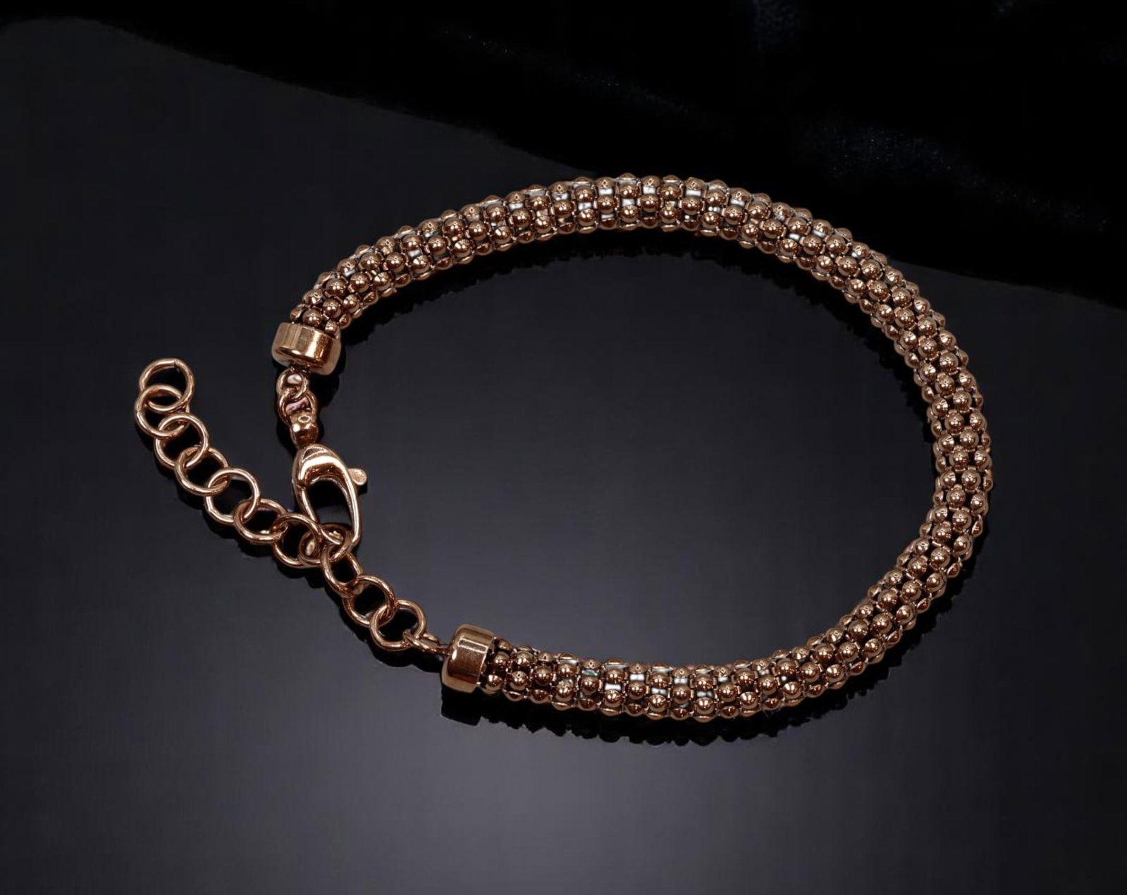 CONTEMPORARY: Woven Bead Bracelet - Metallic Bronze Tone, Lobster Clasp (23cm): A sleek contemporary bracelet featuring a tightly woven pattern of metallic bronze-tone beads, finished with a polished lobster clasp and adjustable extender chain. Measuring approximately 23 cm in le