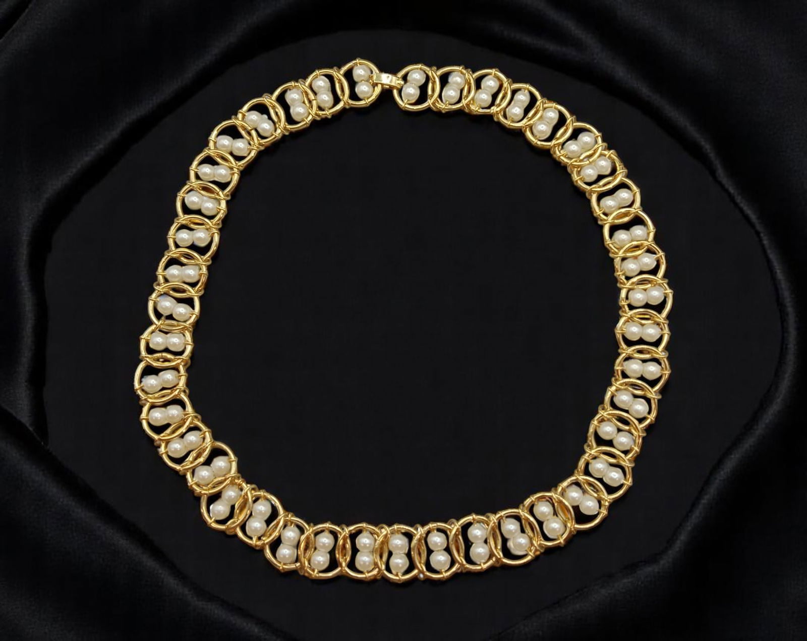 MODERN ROMANTIC: Pearl-Like Collar Necklace - Interlinked Goldtone Frames & Paired Beads (44 cm): This 44 cm collar necklace radiates romantic charm with a sculpted elegance. Each goldtone openwork link encases a pair of pearl-like beads in a repeating pattern, creating a rhythmic, almost lace-lik